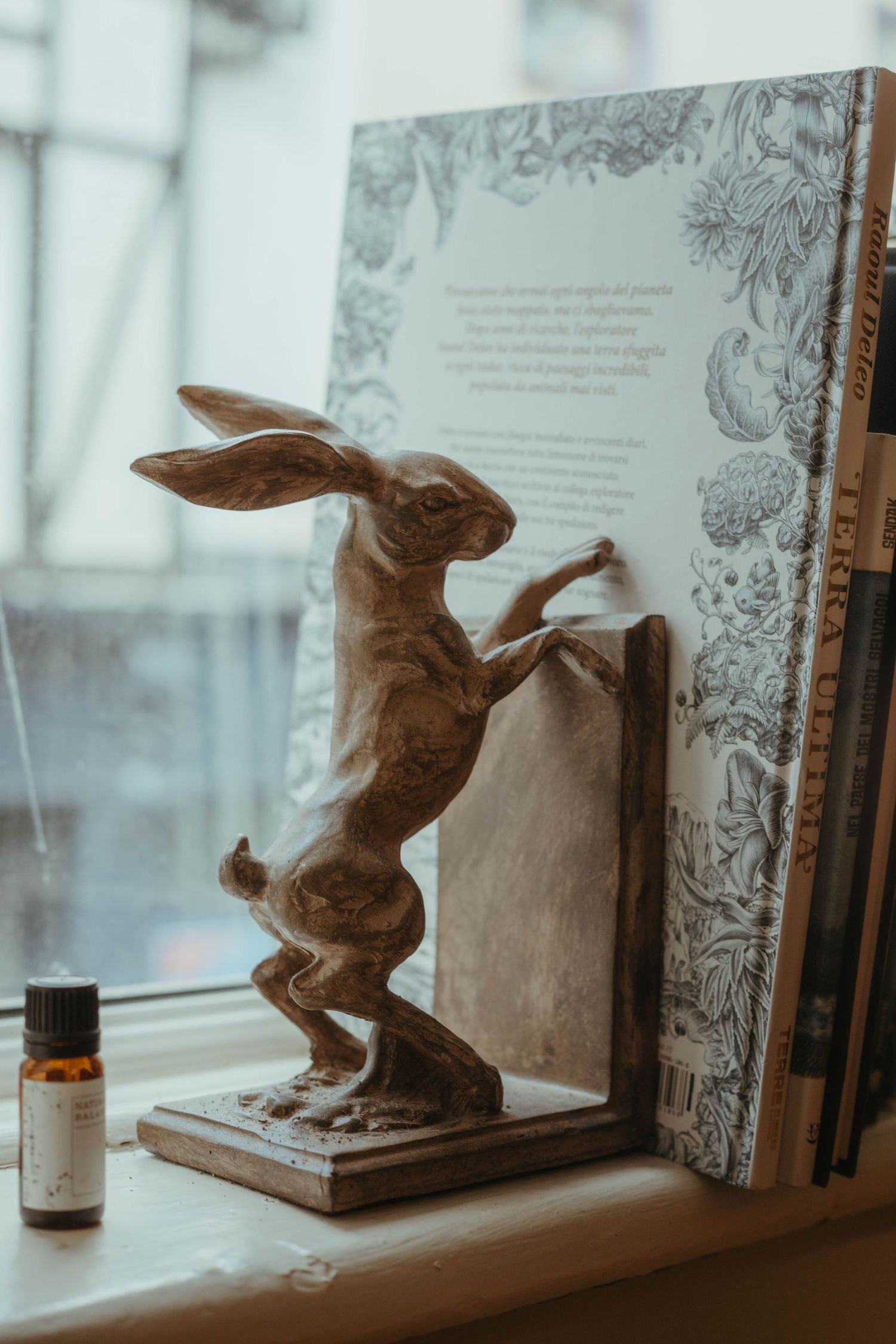 detail shot of a tattoo studio of a book stopper with a hare