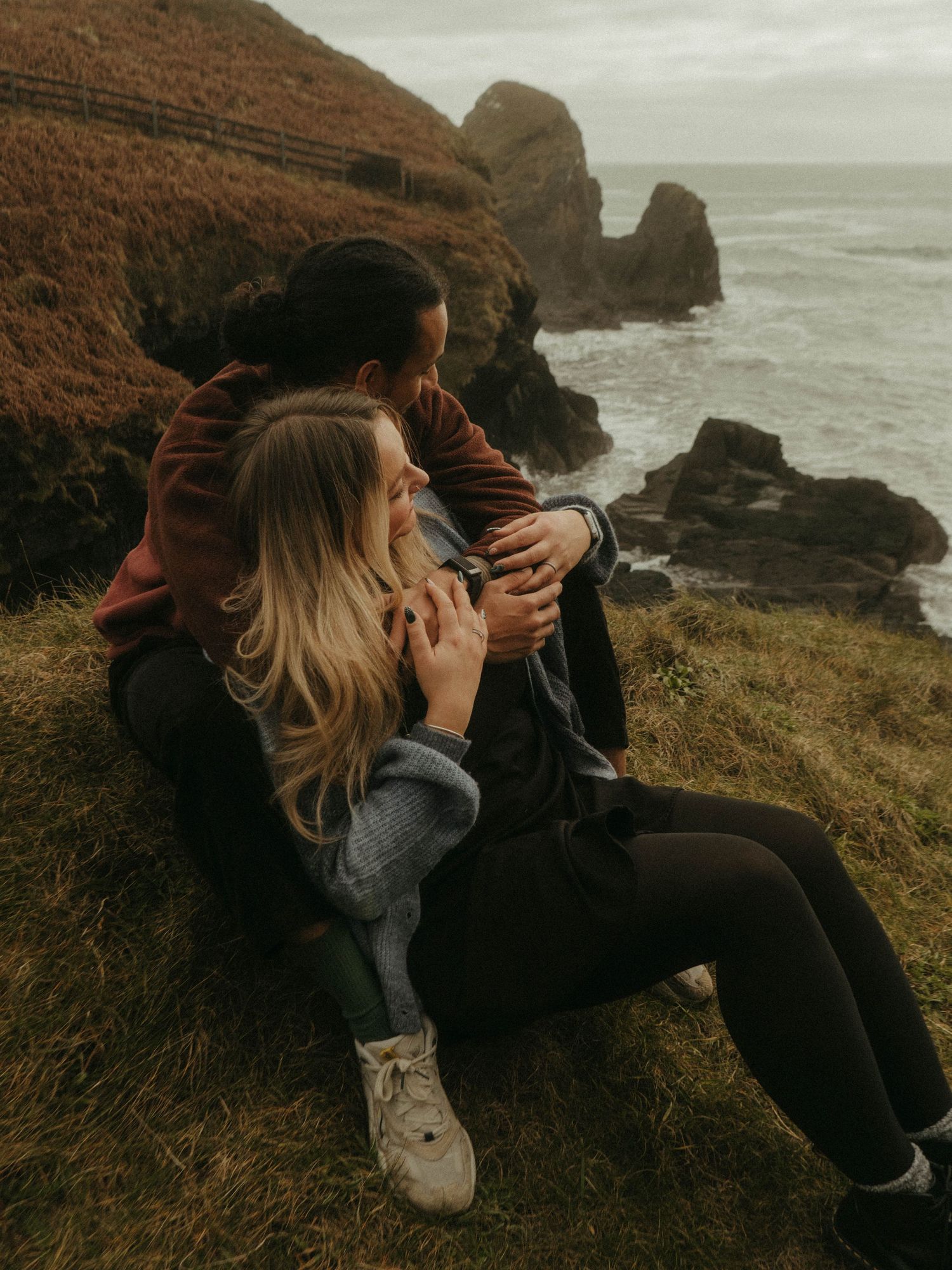 Photograph of couple posing at Nohoval Cove in Cork, Ireland.