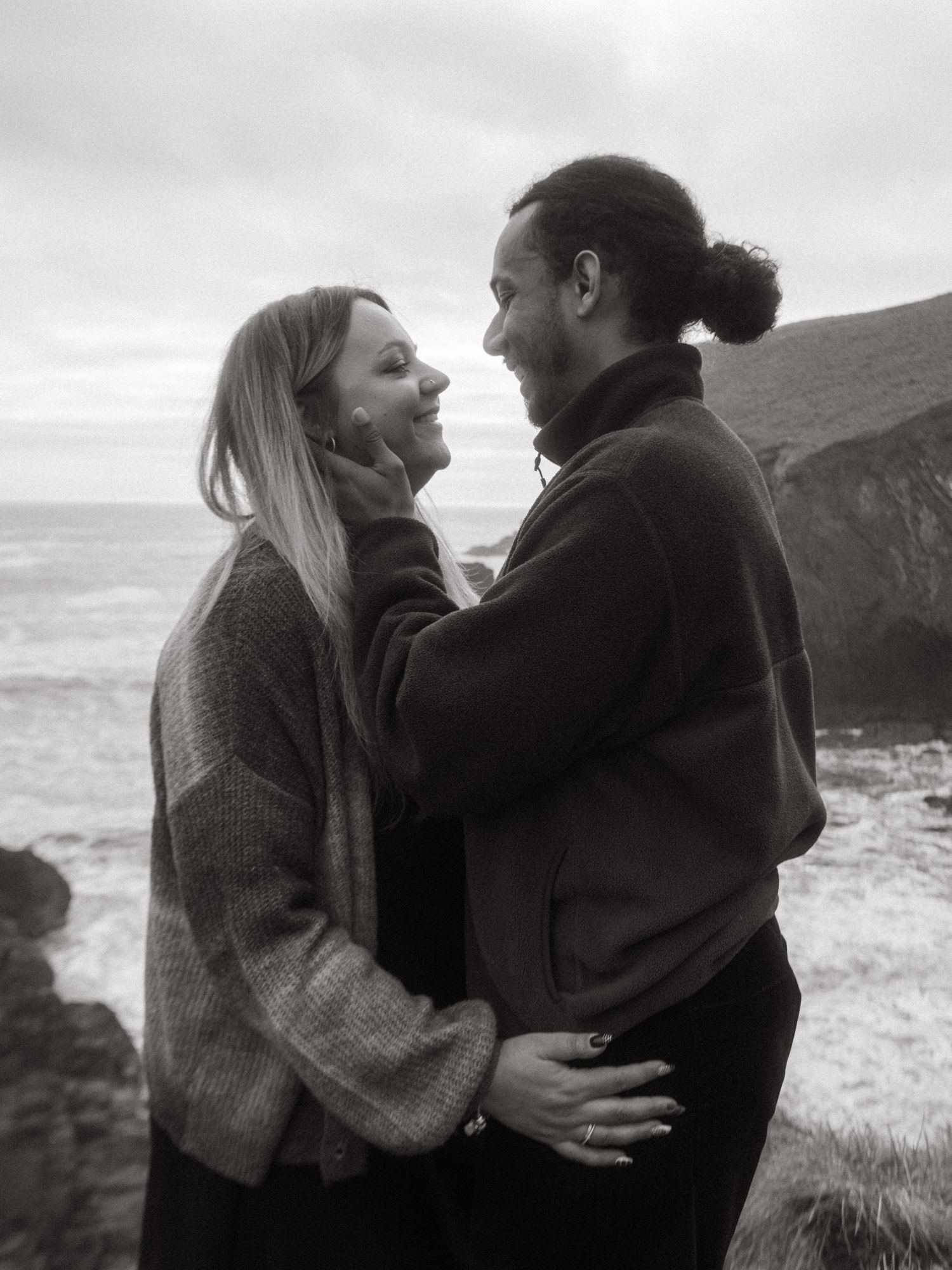 Photograph of couple posing at Nohoval Cove in Cork, Ireland.