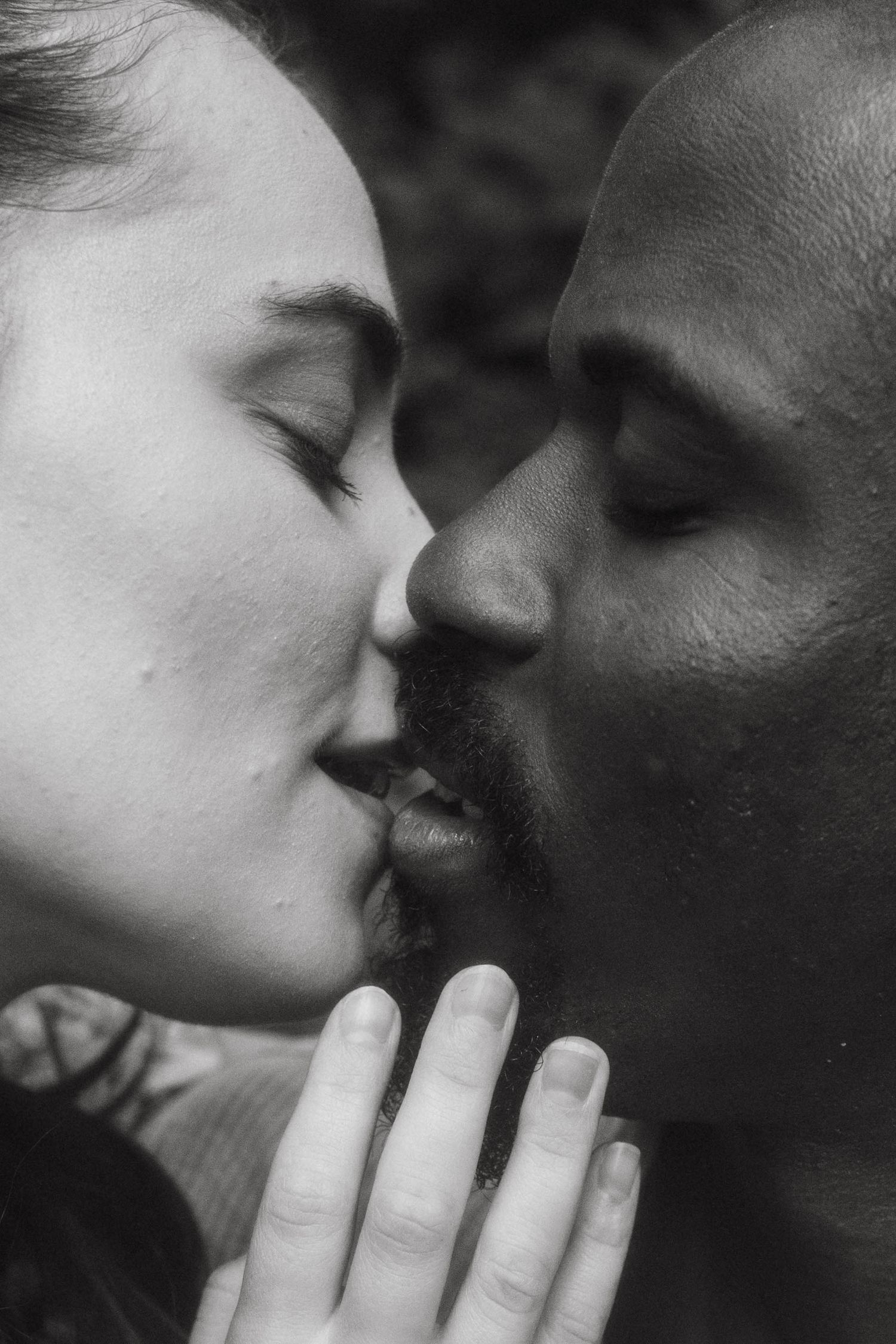 Black and white photograph of couple just before kissing