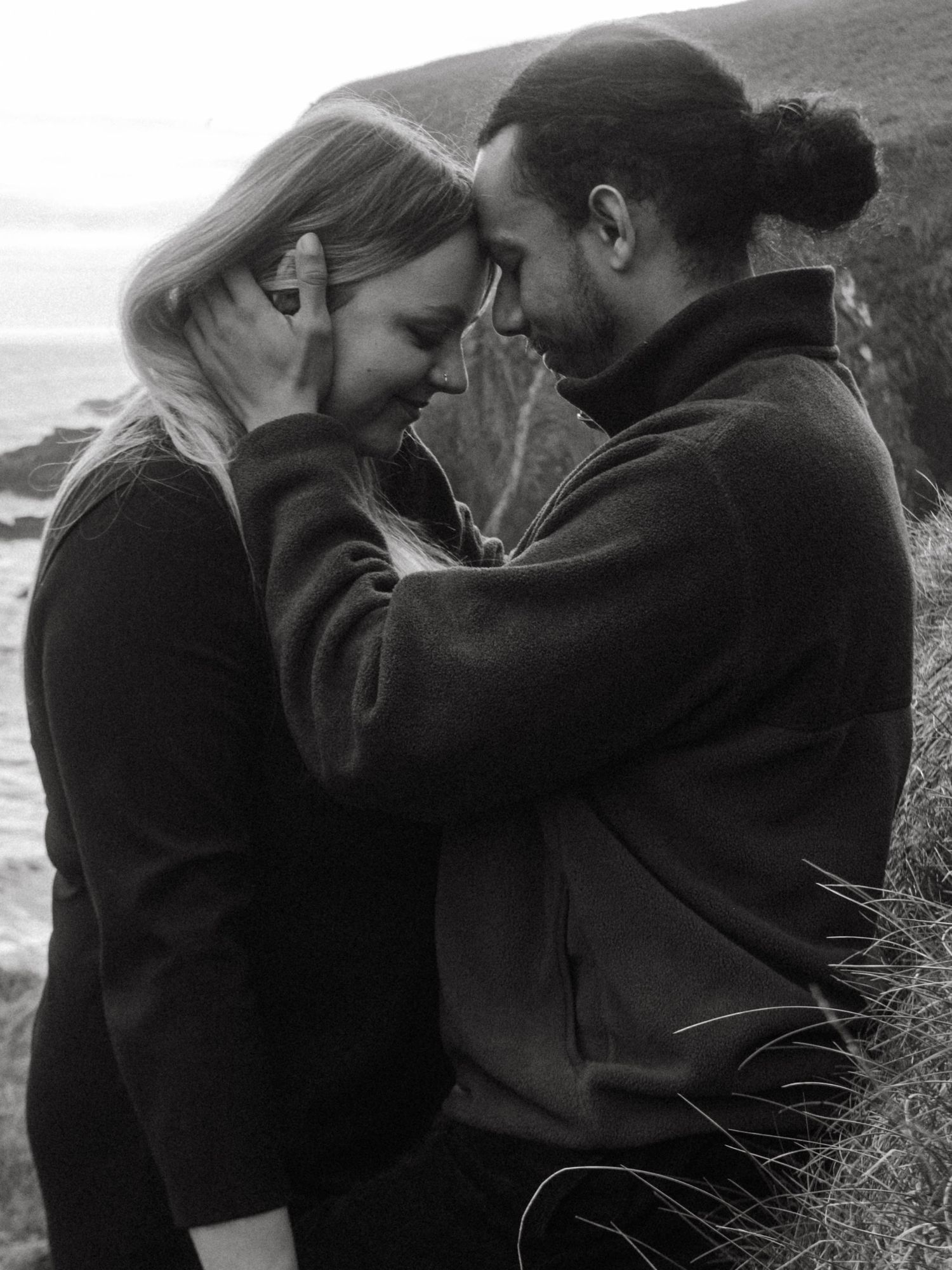 Photograph of couple posing at Nohoval Cove in Cork, Ireland.