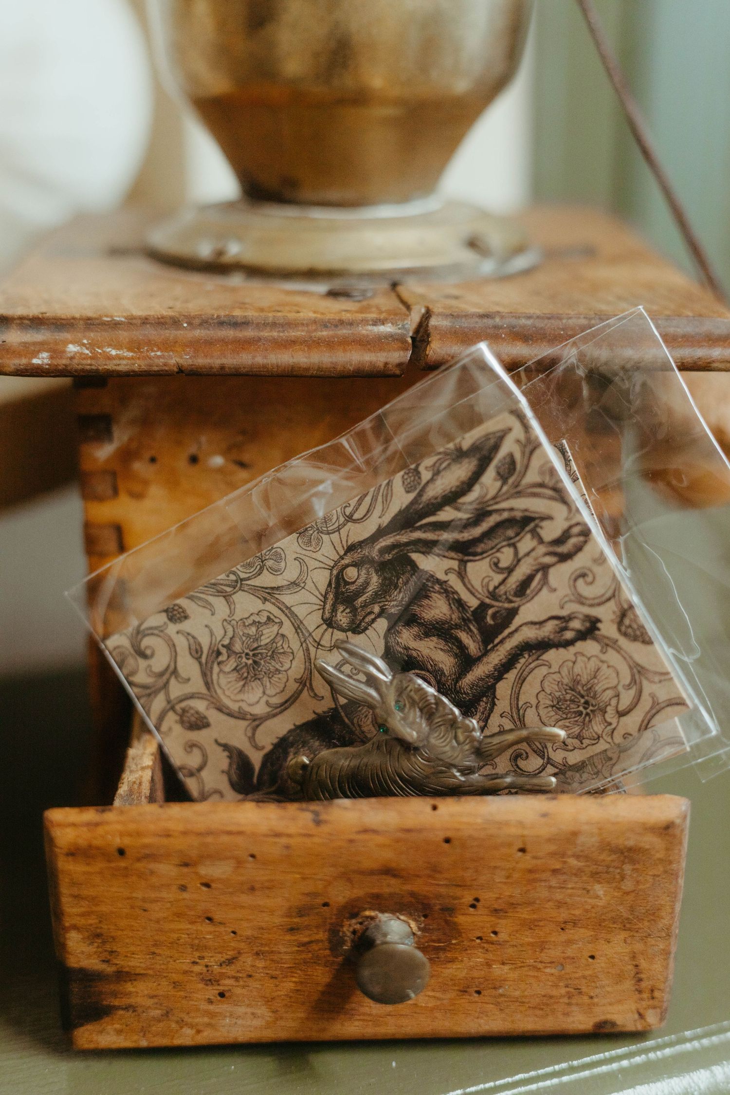 detail shot of a tattoo studio of a silver plague with a hare