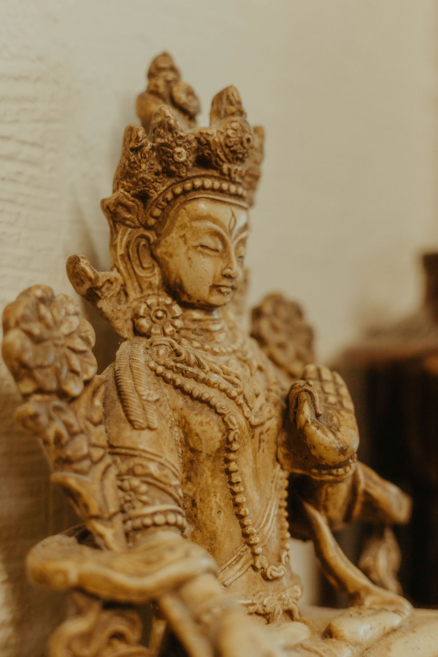Detail shot of tattoo studio of a wooden figurine