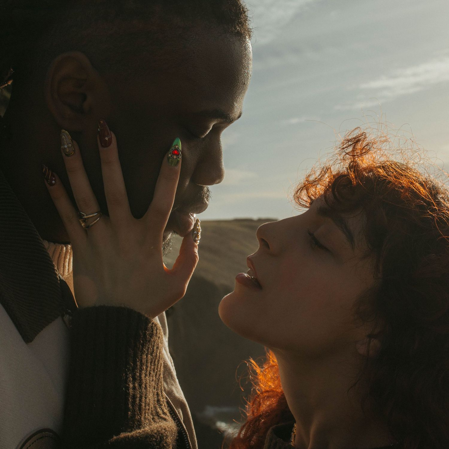 Close up of couple, she's holding his face