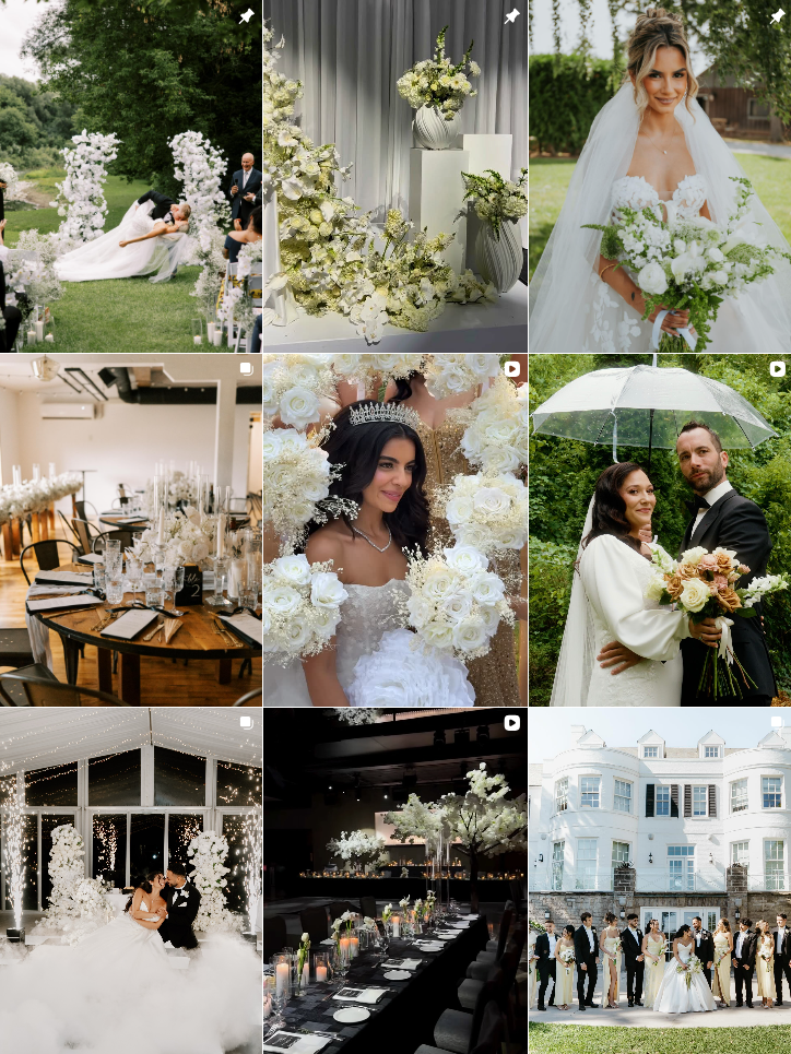 Elegant wedding reception venue with white floral arrangements, crystal chandeliers, and modern table settings.