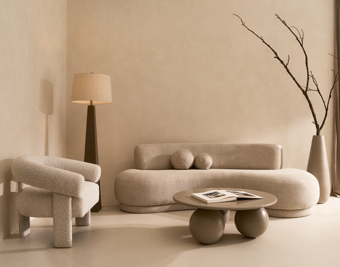 Minimalist ceramic vessels and decorative objects arranged in monochromatic display against neutral background. Studio by House Mississauga