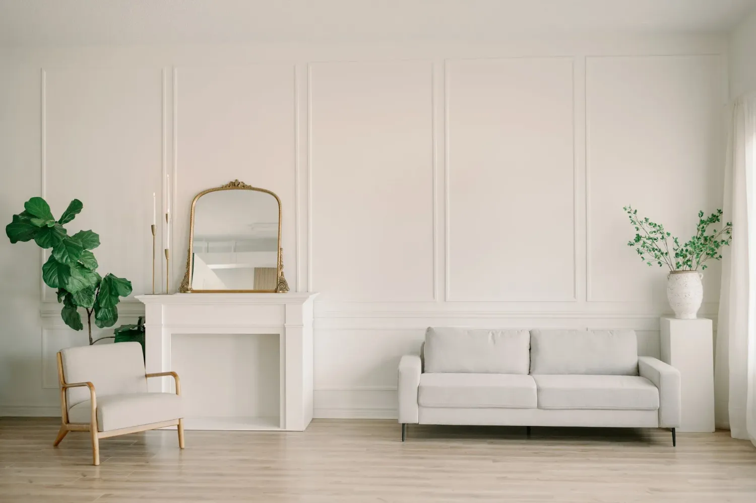 A minimalist white studio space with white furniture, walls and decor creating a clean, monochromatic interior. Wild Field Studio, Guelph