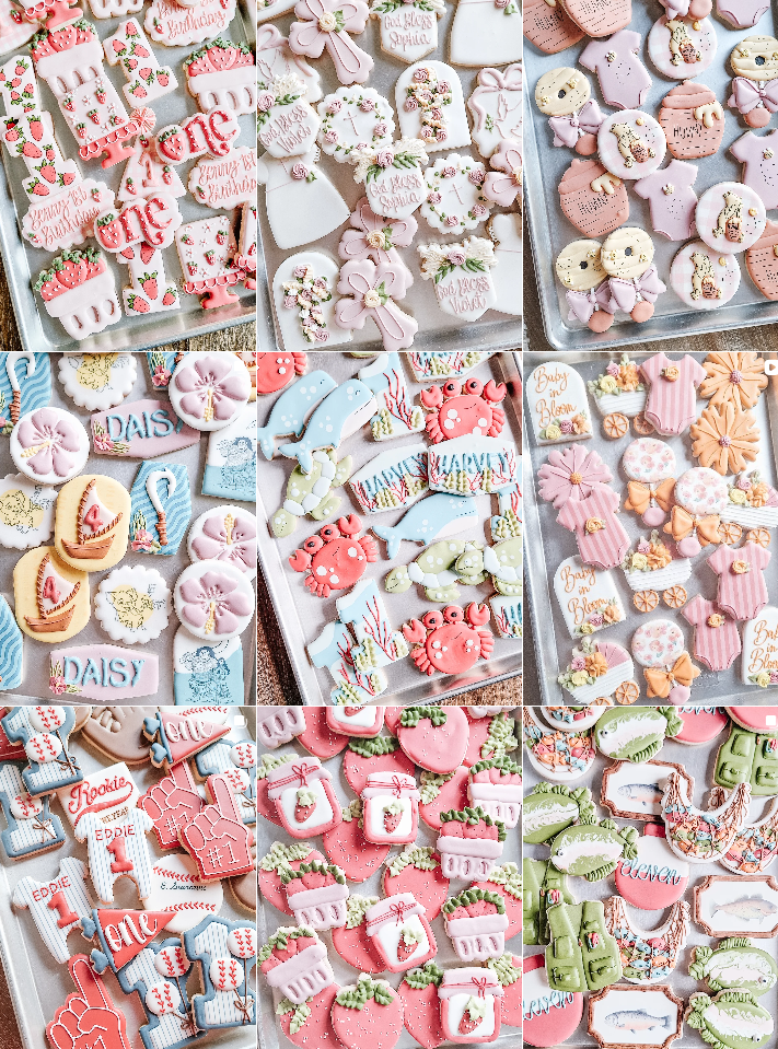 Colorful assortment of decorated sugar cookies with pink and white icing displayed on a retail wall.