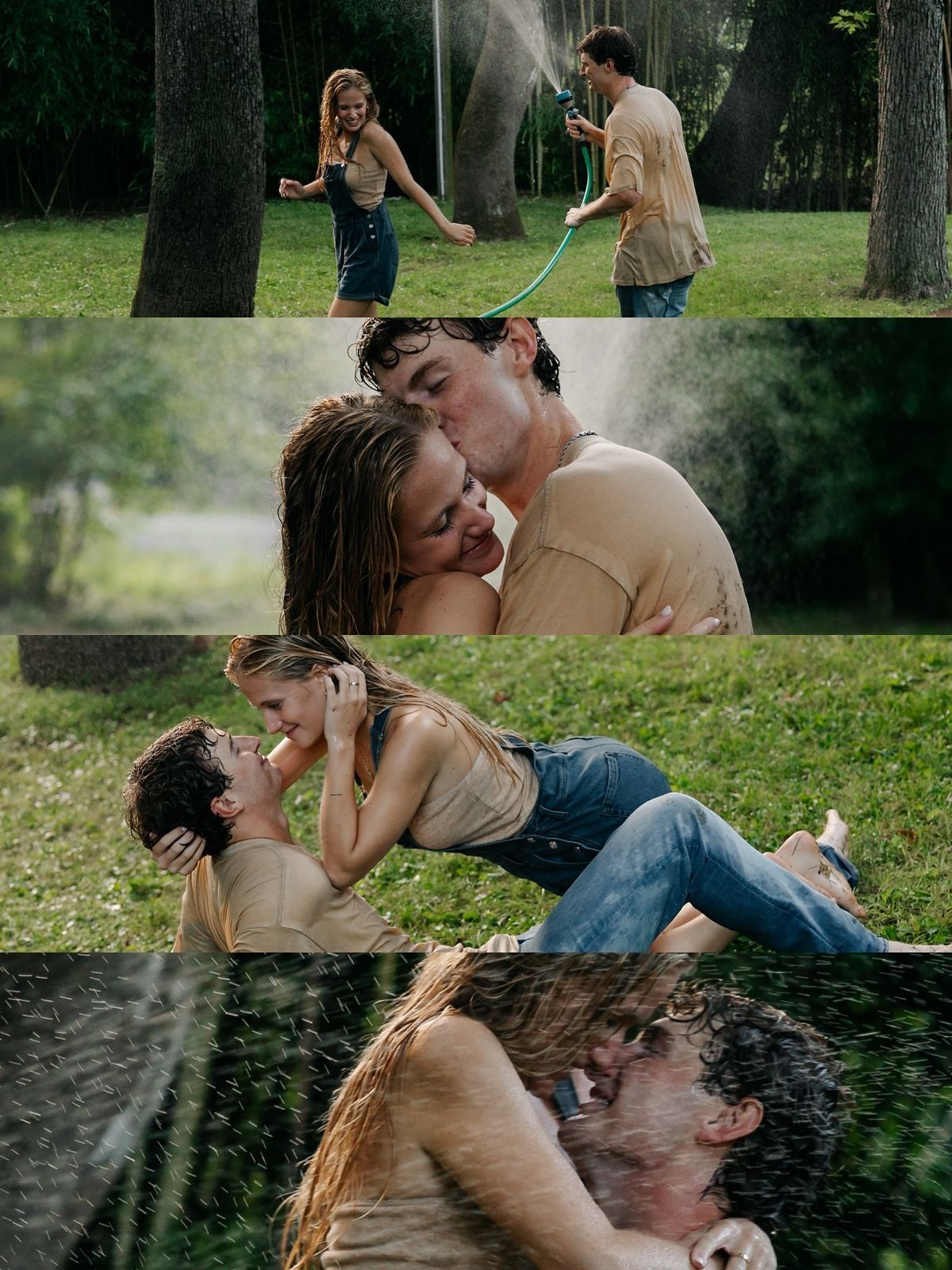 A romantic couple shares a kiss in the rain while playing with a garden hose outdoors in a lush green park.