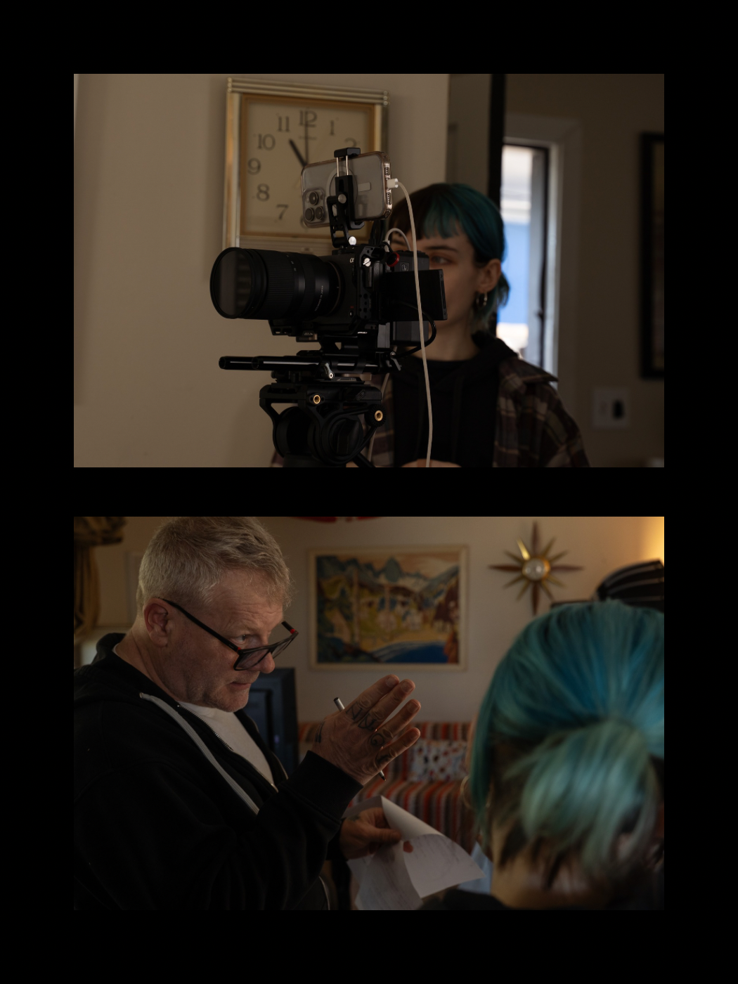 A blue-haired cinematographer films through a professional camera while a director reviews materials nearby.