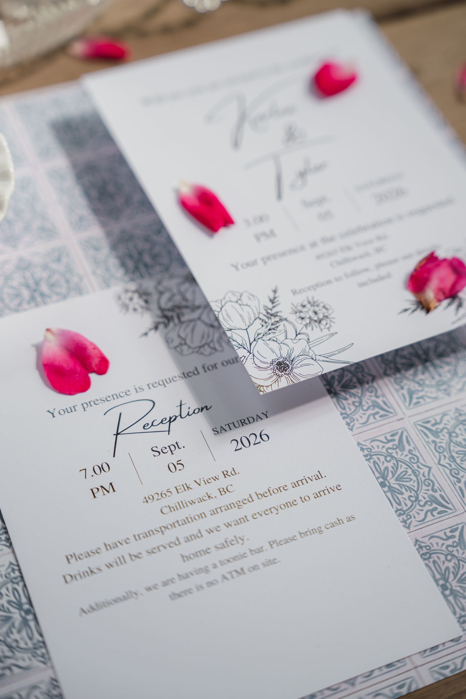 Elegant wedding reception invitation with floral design, pink rose petals, and details for a 2026 ceremony in Chilliwack, BC.