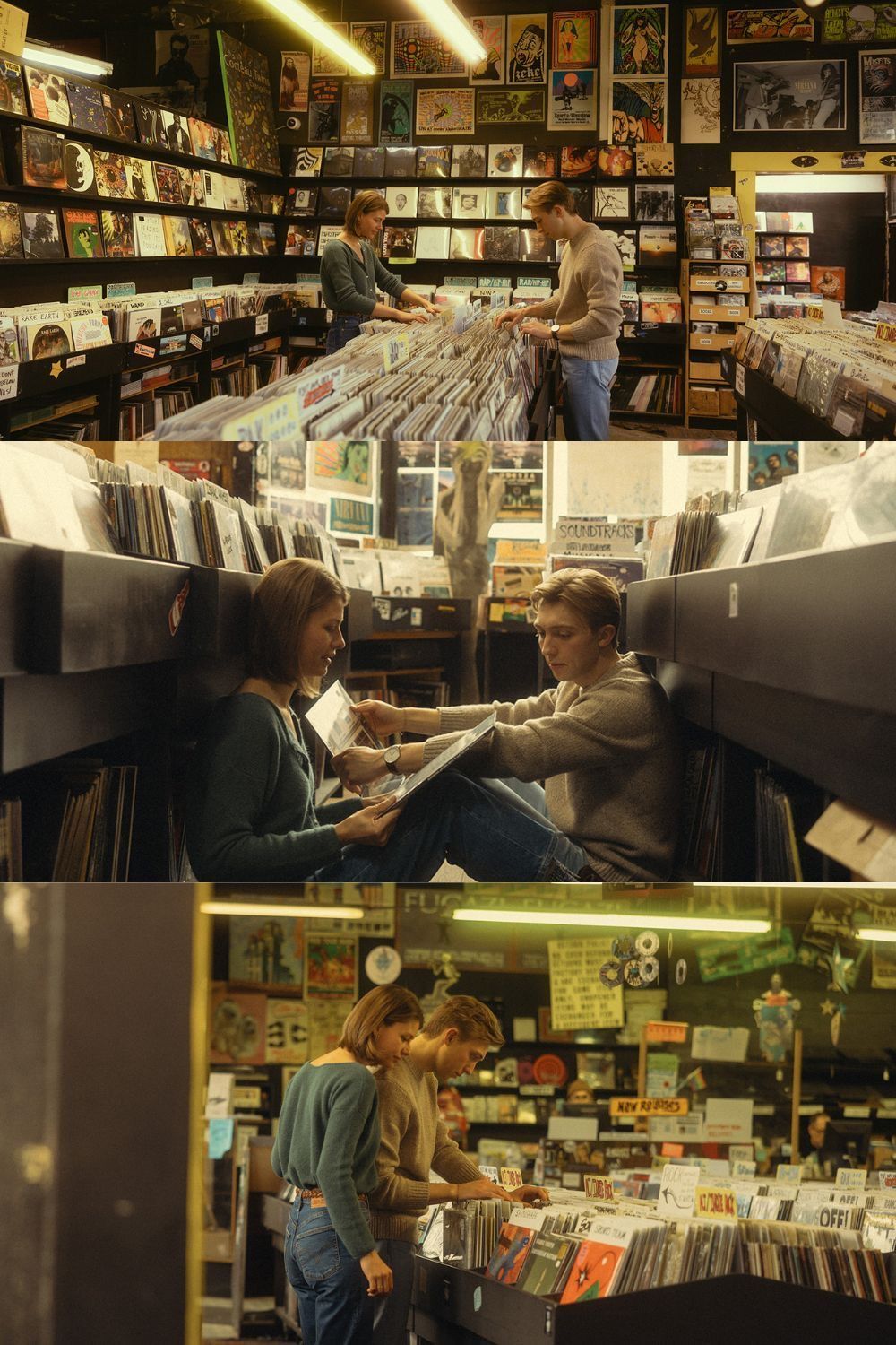 Two people browsing vinyl records in a cozy, well-stocked record store filled with album covers on the walls.