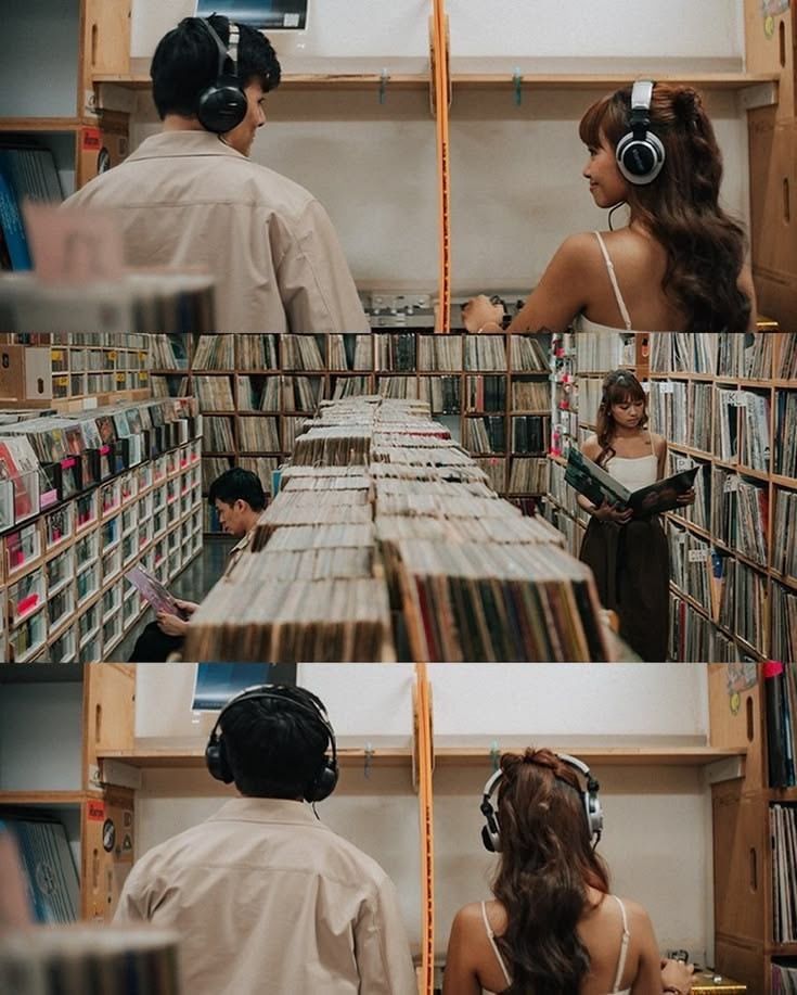 Two people wearing headphones browse vinyl records in a cozy music store filled with shelves of albums.