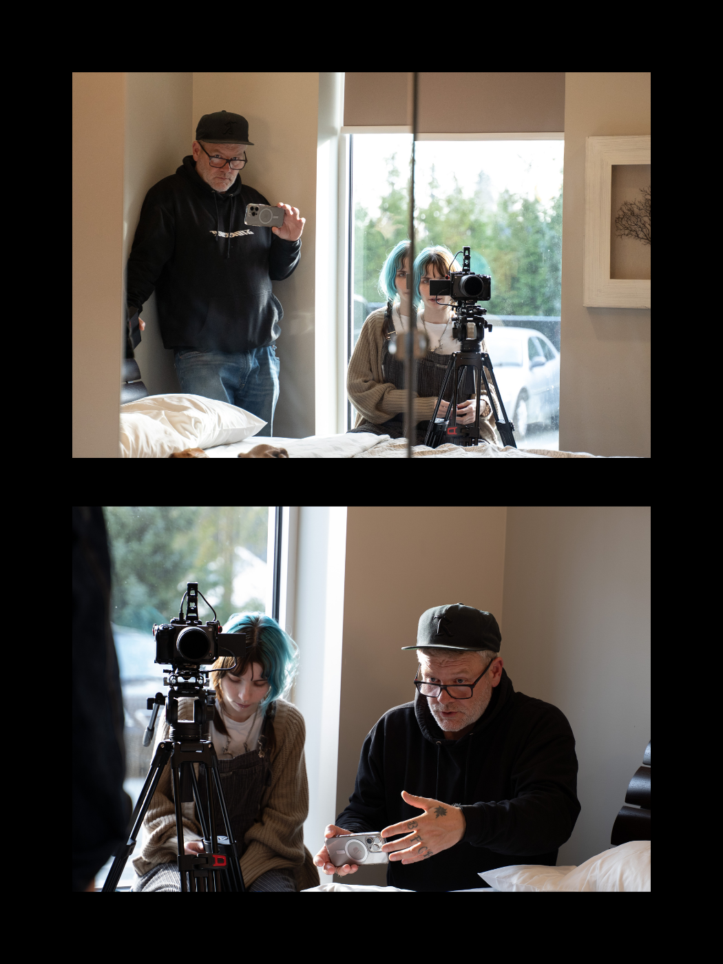 Film crew members set up cameras and review footage on a smartphone during an indoor production shoot.
