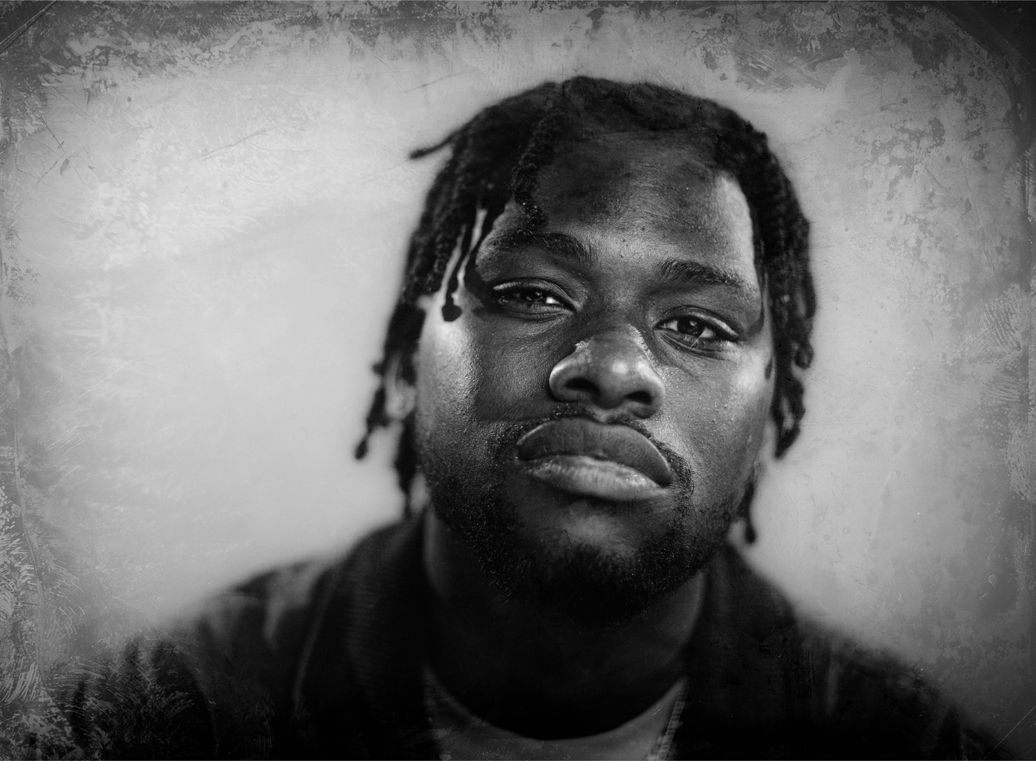 Black and white portrait with textured vintage effect.