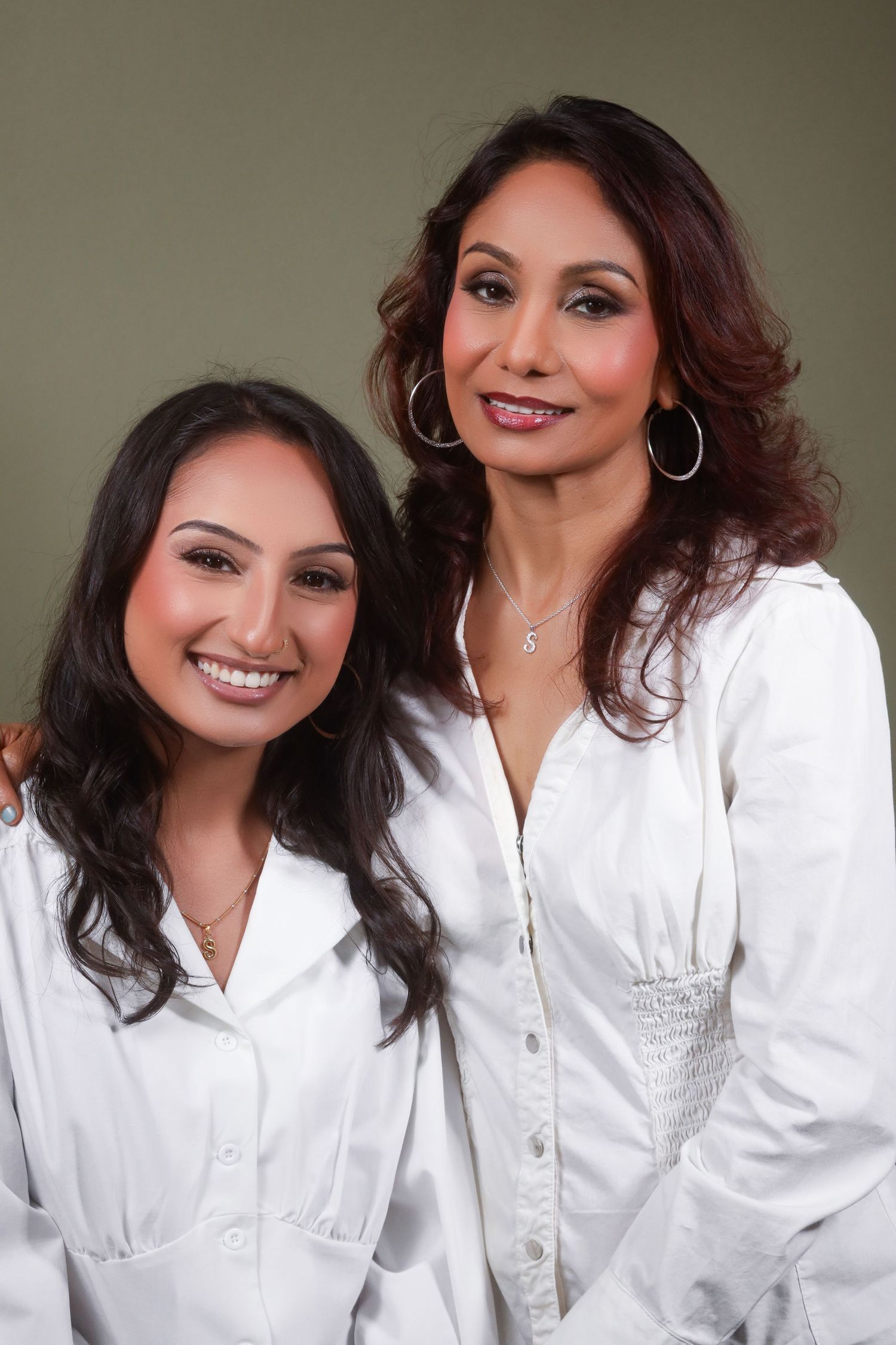 Collection of professional headshots featuring white shirt and silver accessories.