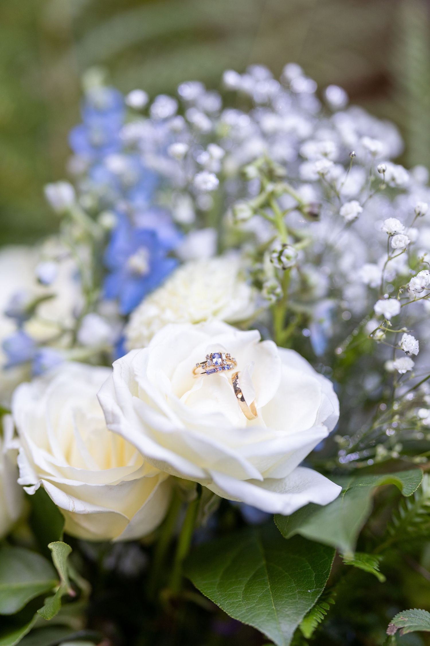 Close-up series of delicate white roses and blue forget-me-nots arranged in a romantic floral bouquet.