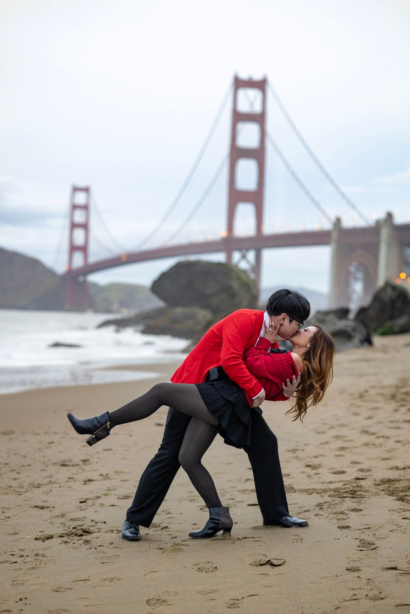 A romantic dance sequence on Baker Beach with the Golden Gate Bridge in the background.
