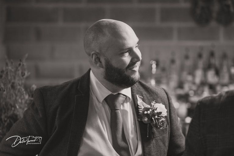 Black and white wedding photography capturing candid moments during the ceremony.