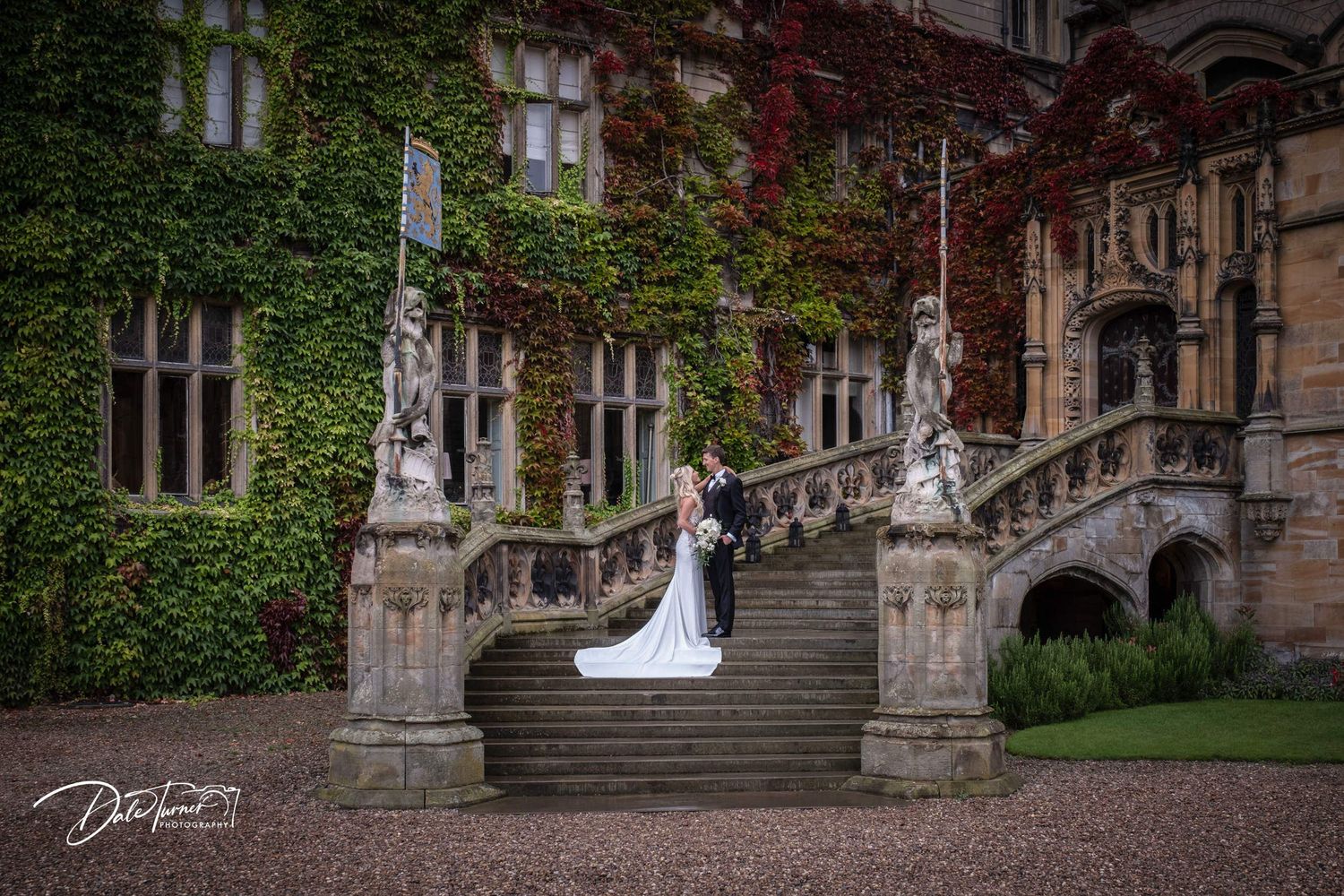 Ivy-covered stone building exterior with Gothic architectural details and stone steps.