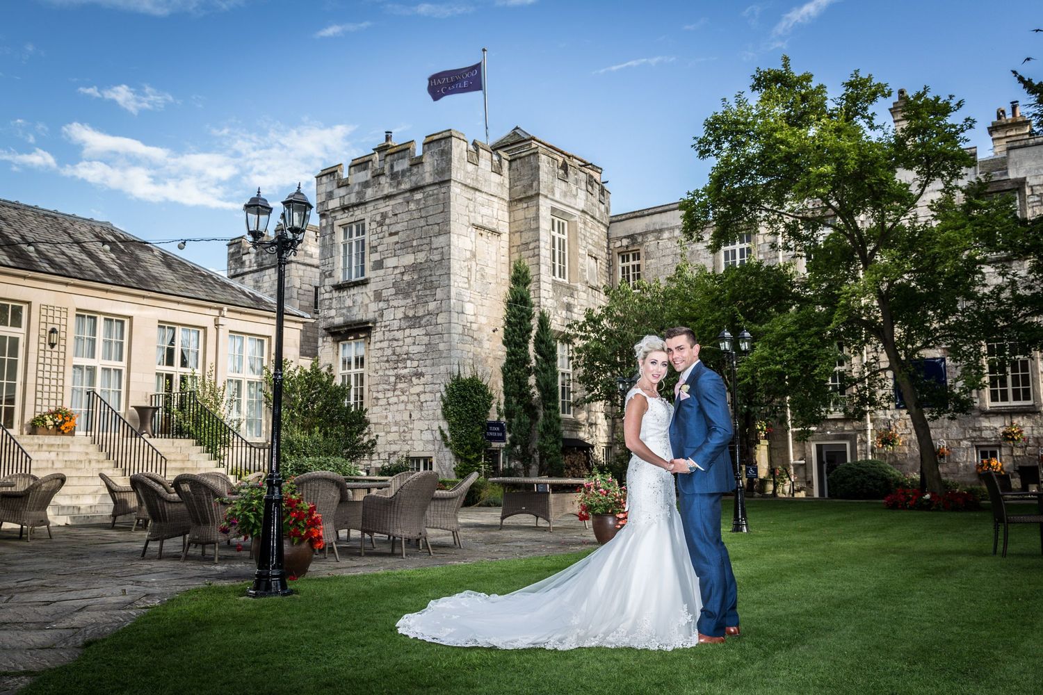 Wedding photography session around stone castle grounds with classic architecture and landscaping.