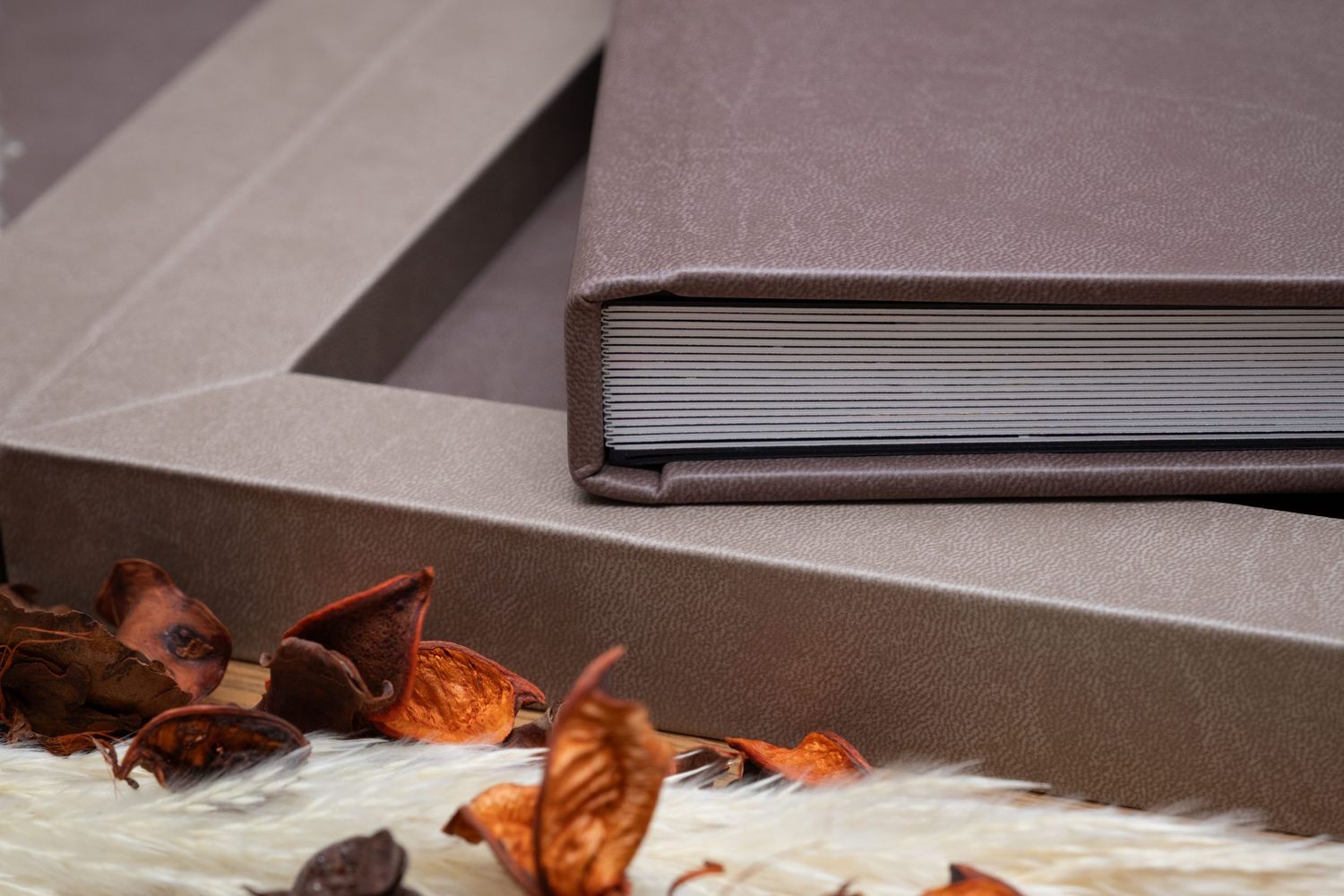Close-up of a premium gray leather wedding album cover with elegant binding.