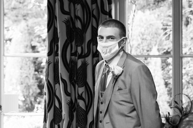 Wedding ceremony photos in black and white showing guests wearing protective masks during pandemic.