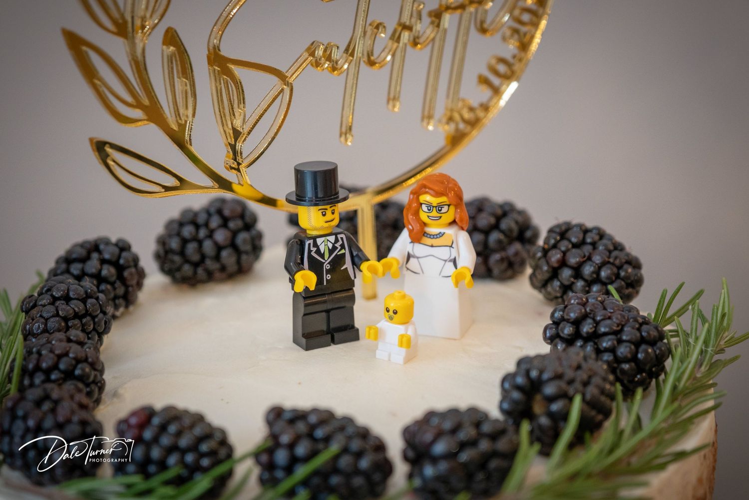 LEGO minifigures arranged with fresh blackberries and golden antlers in a creative food photography composition.