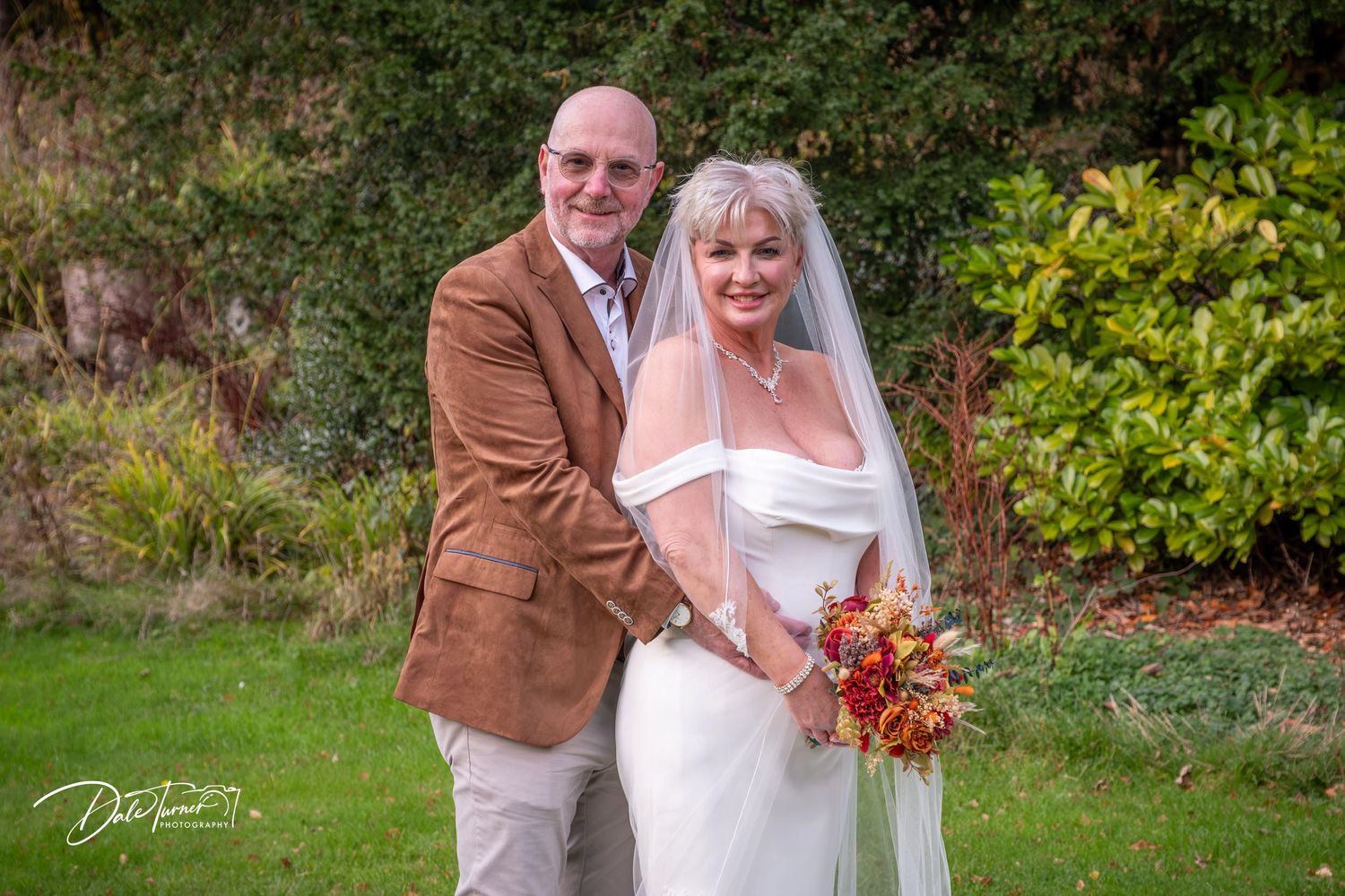 Outdoor autumn wedding photography session featuring rustic and elegant styling.