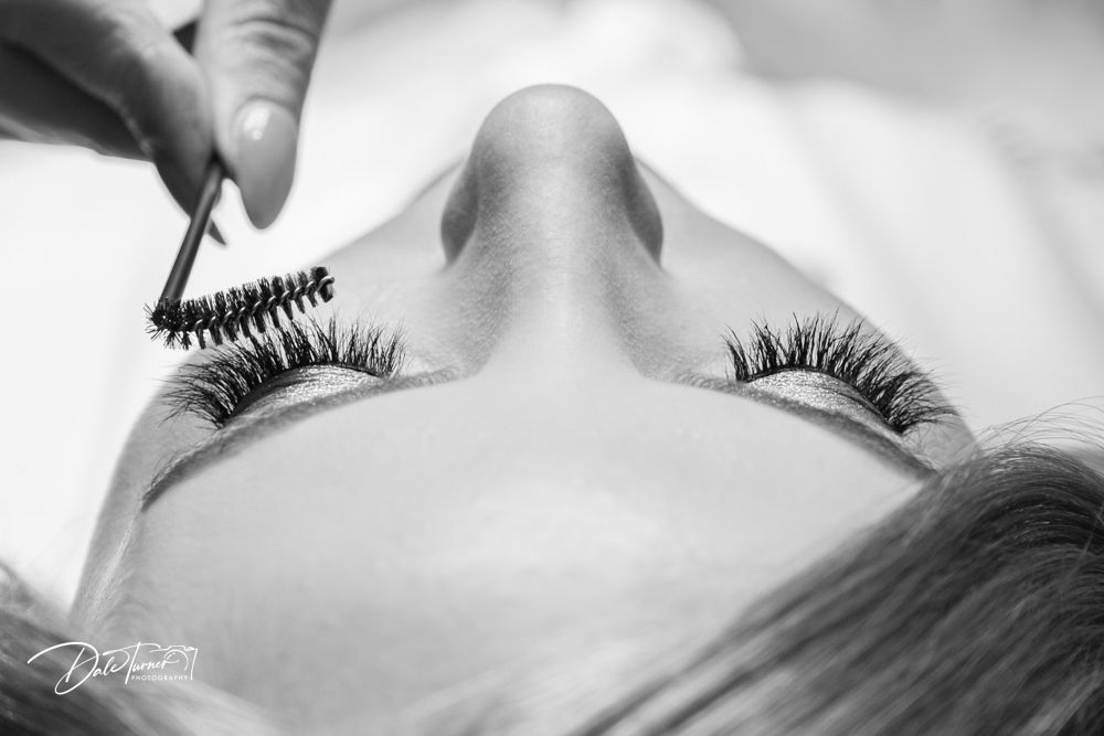 Artistic black and white macro photography of eye details and makeup.