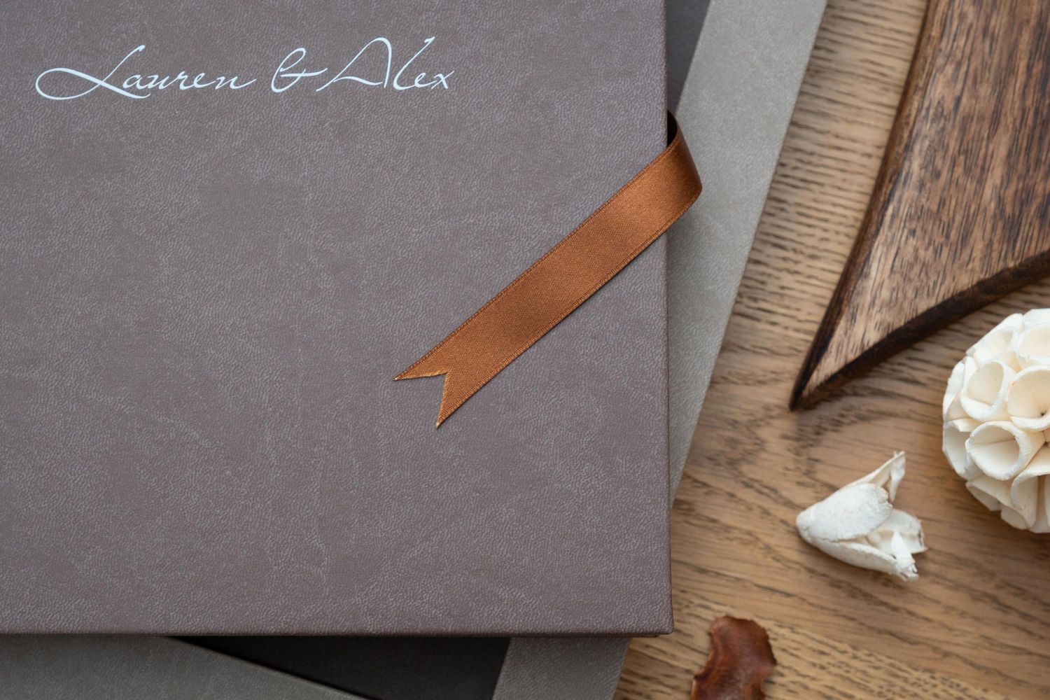 Wedding album with custom text and elegant gray leather finish.