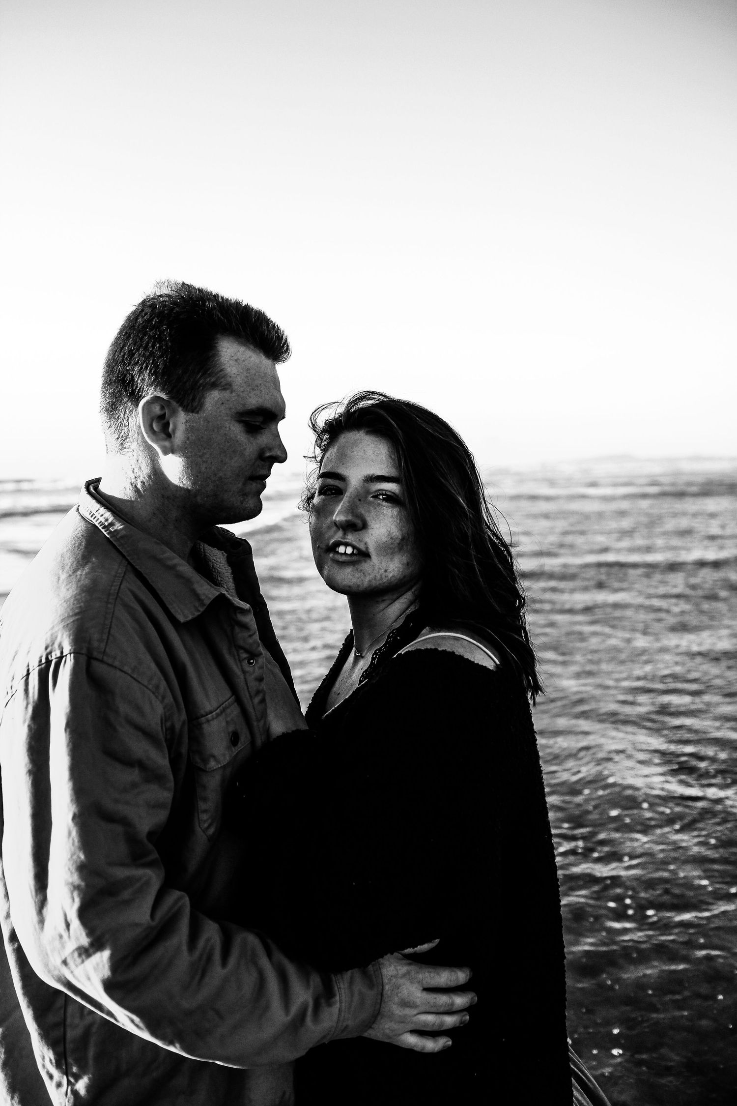 artistic portrait of couple on beach in Encinitas, California