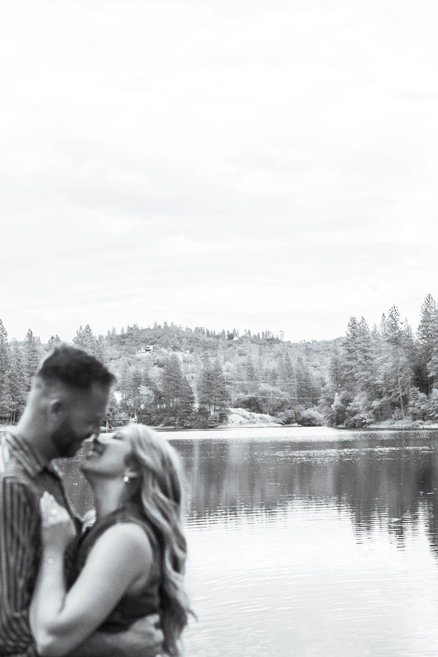 man and woman standing by lake in Pine Grove, California