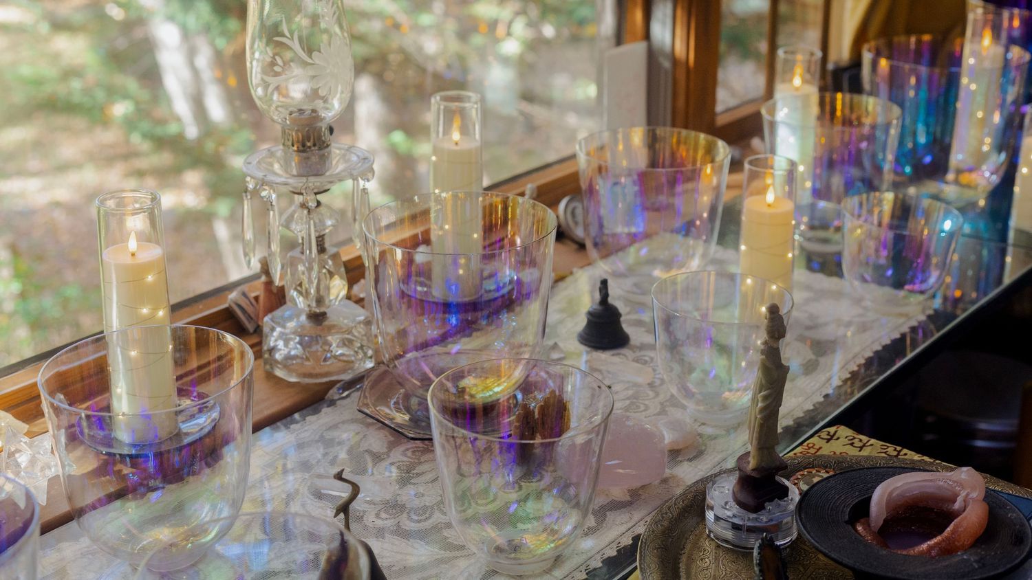 Abstract multiple exposure photograph of glassware and lighting in an indoor setting.