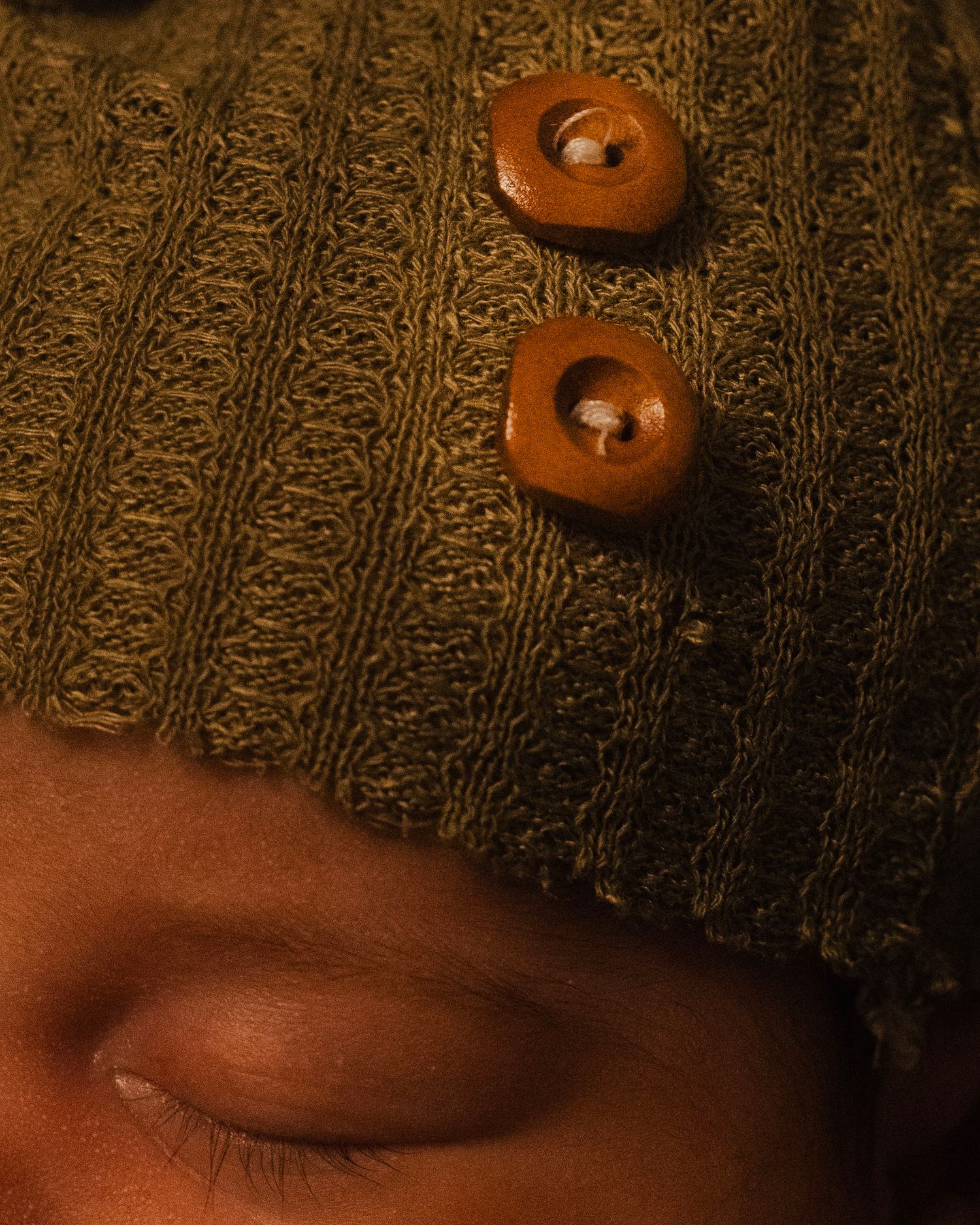 A series of four close-up shots showing progressively zooming in on a textured brown leather surface with intricate patterns.