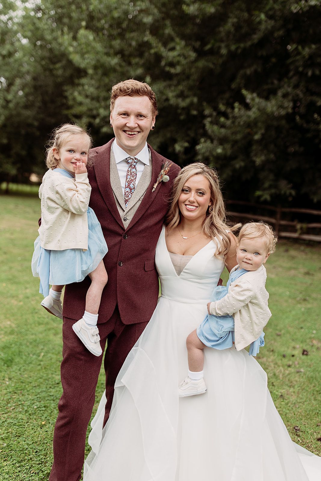 Bride and groom with children at Marleybrook House Kent, personal wedding photo of Derbyshire wedding photographer