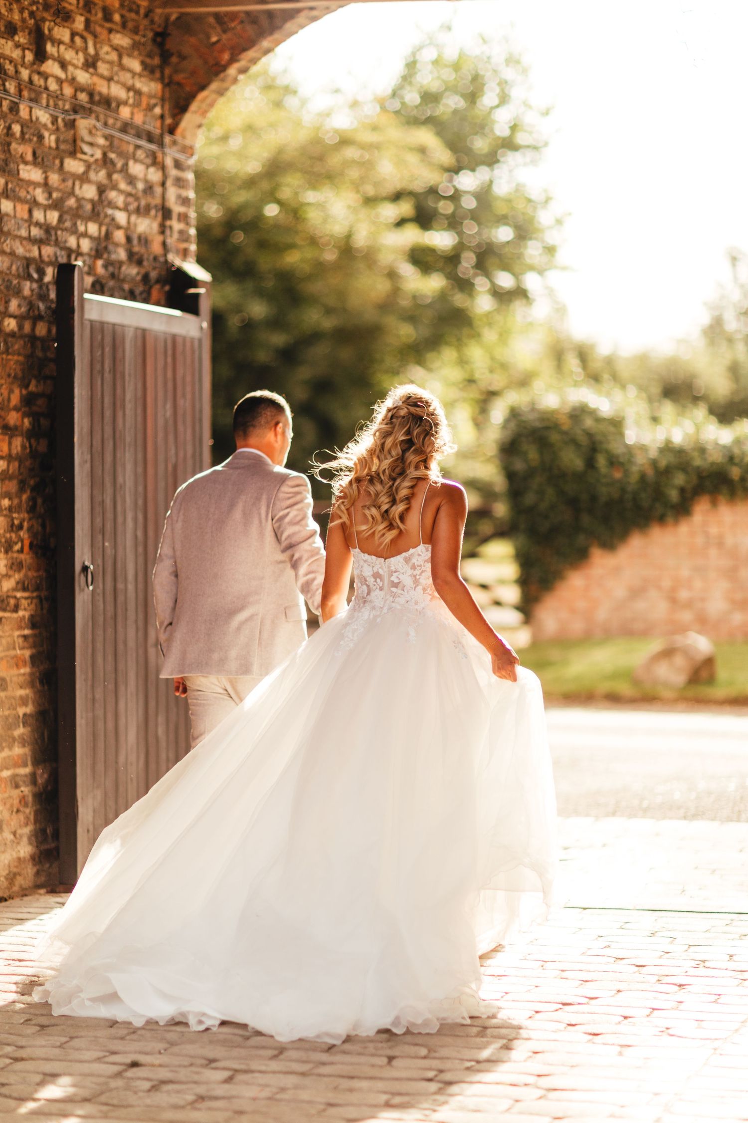 Bride and groom at The Normans Yorkshire barn wedding venue, golden hour barn wedding photography