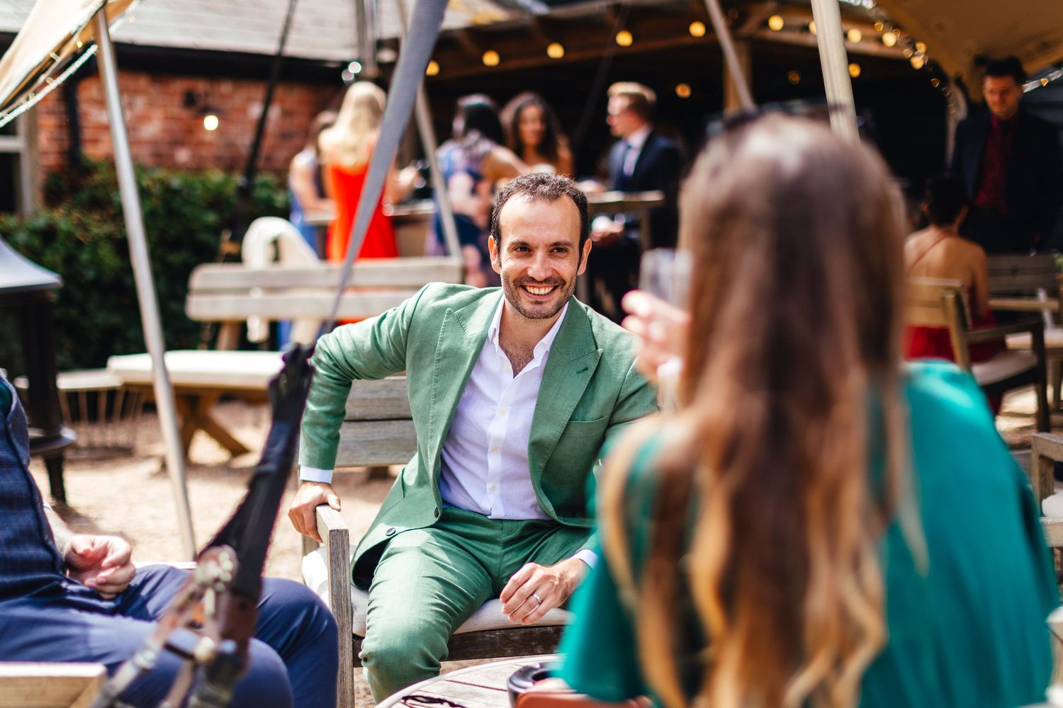 Guests enjoying outdoor reception at Kimbridge Barn wedding in Romsey
