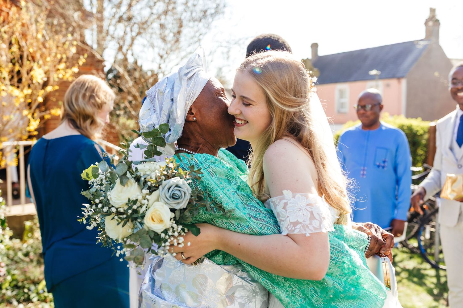 Spring wedding in Oxfordshire with emotional hug, candid documentary wedding photography UK