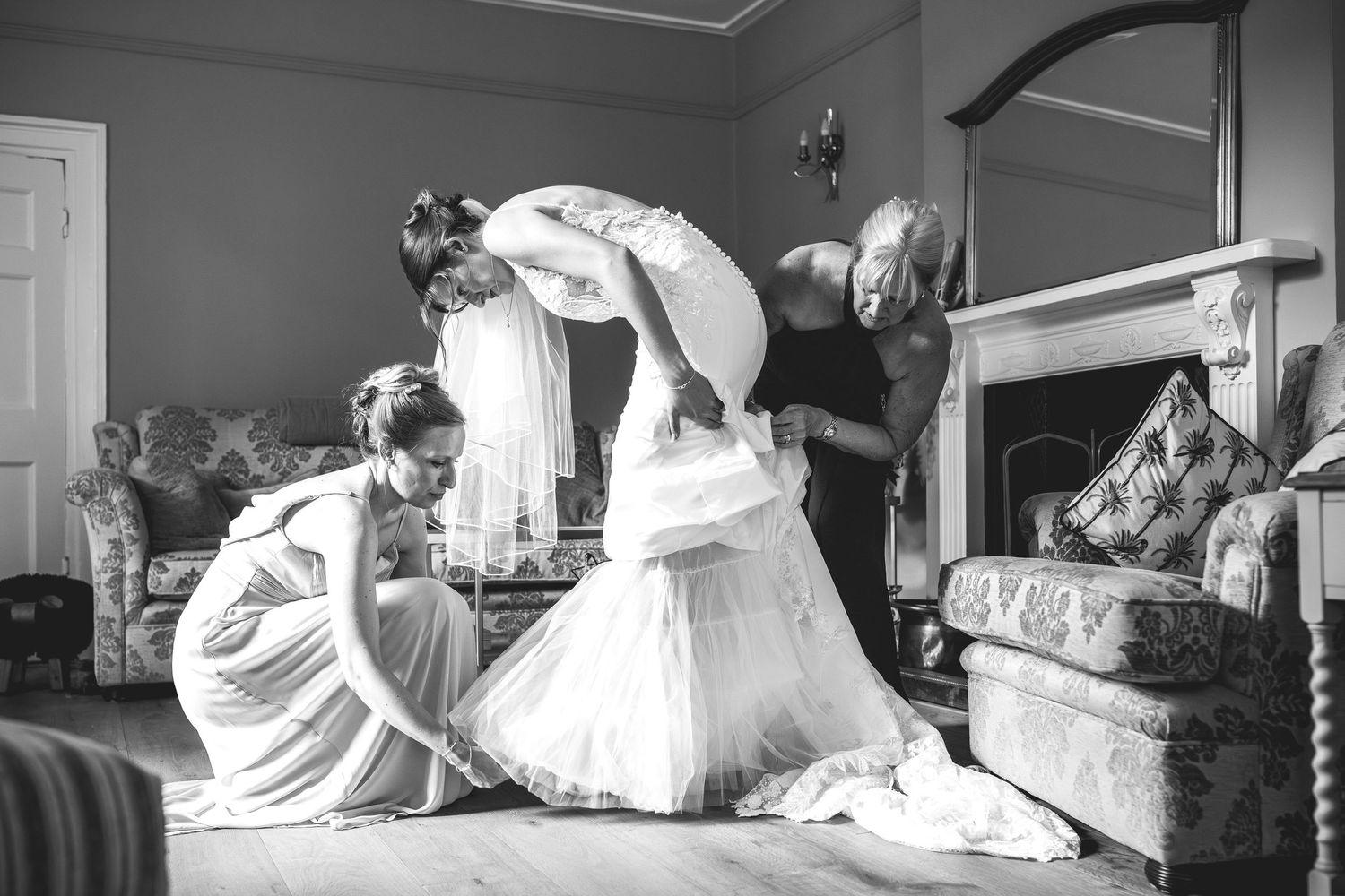 black and white Bride getting ready with bridesmaids in the East Midlands, natural light bridal preparation photography