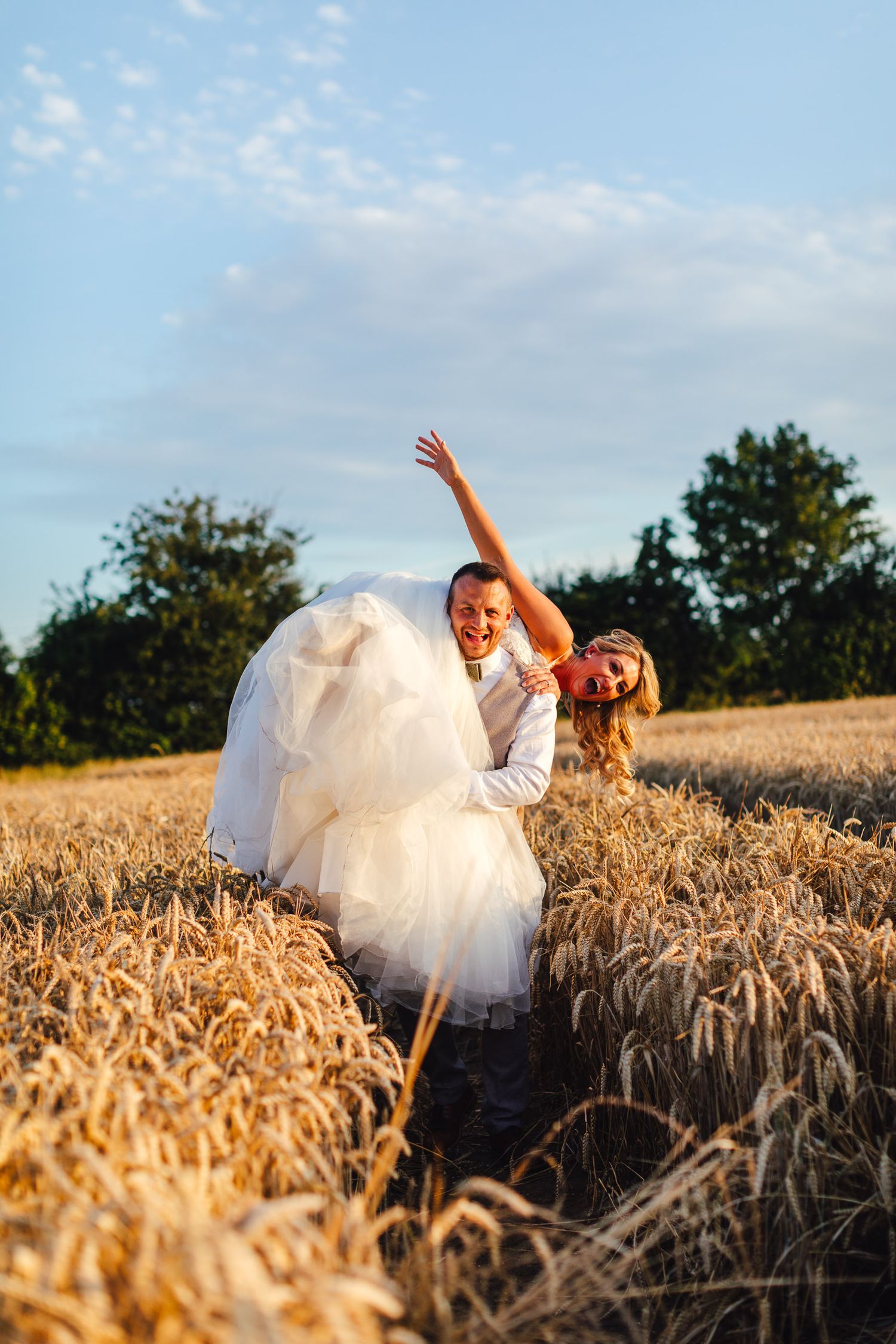 The Normans York golden hour bride portrait in wheat field, North Yorkshire summer barn wedding photography