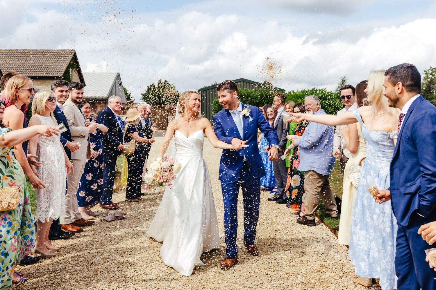 Outdoor wedding confetti moment at Huntsmill Farm, documentary wedding photography