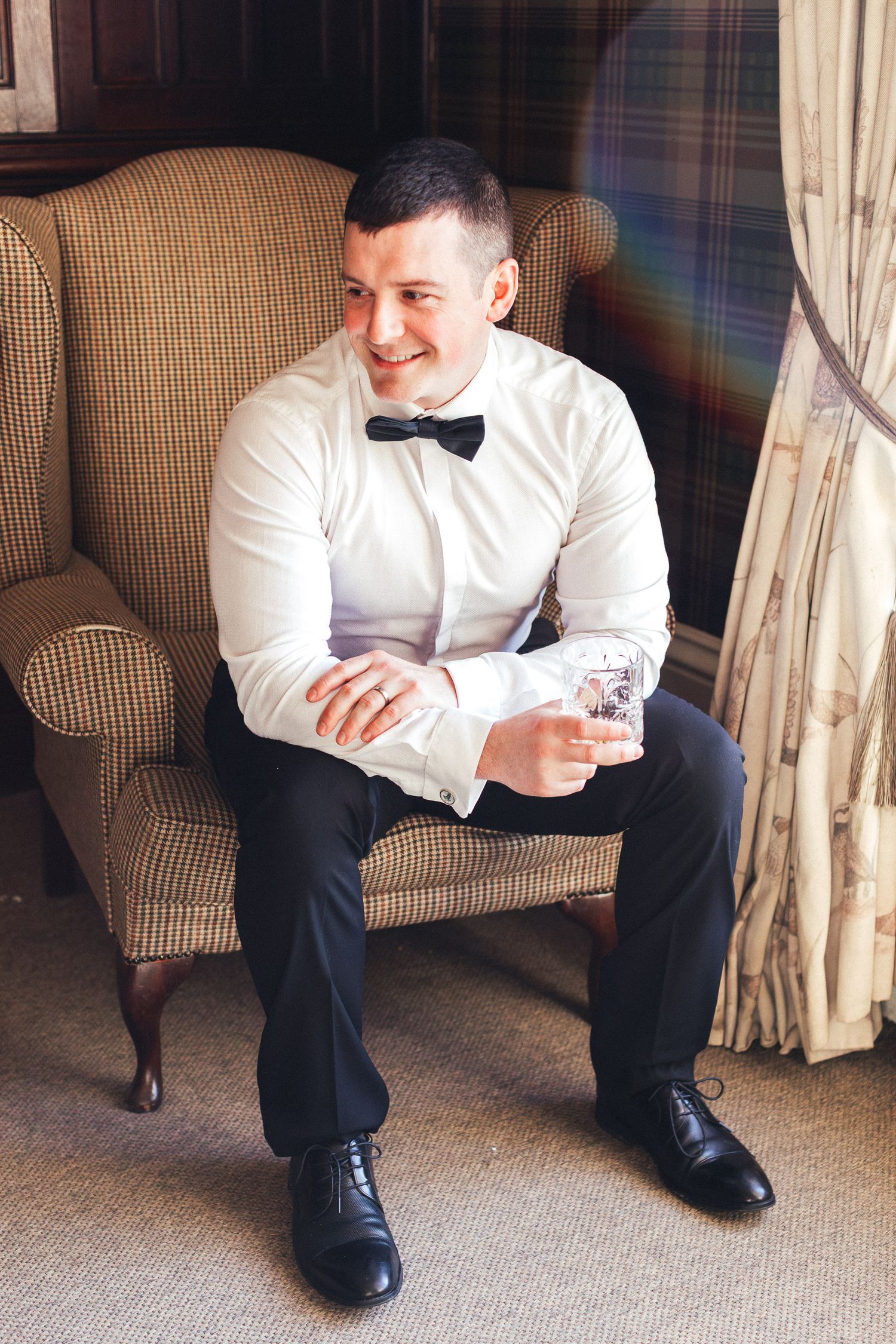 Relaxed groom portrait at Falcon Manor Settle, modern country house wedding photography in North Yorkshire