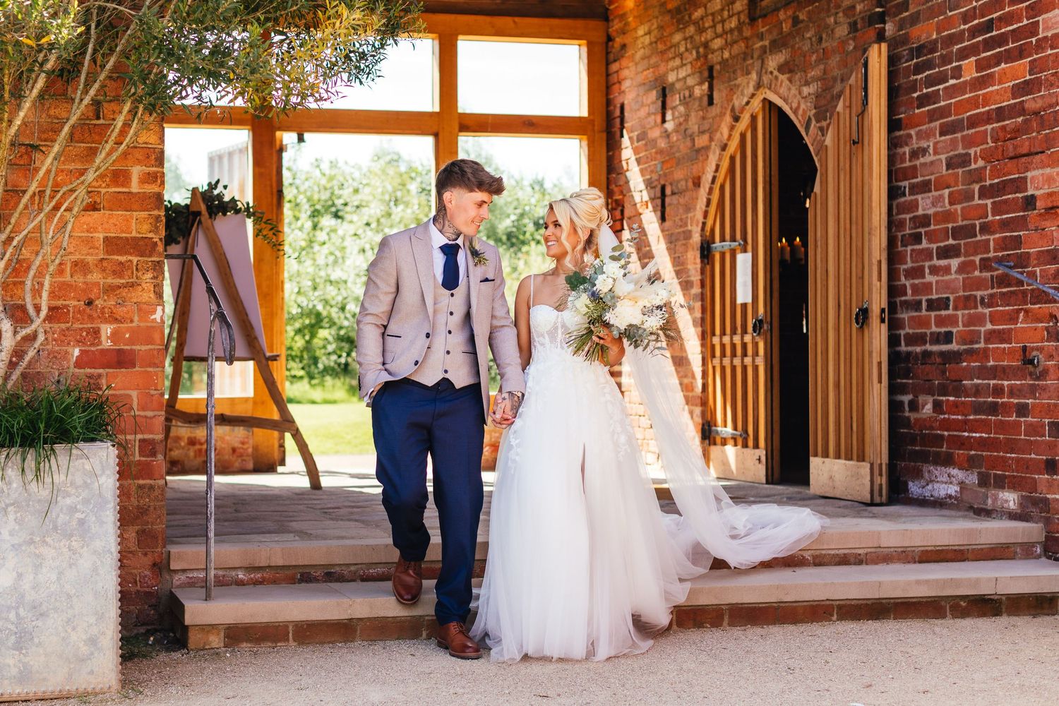 Grangefields Derbyshire barn wedding photography, bride and groom leaving ceremony at luxury East Midlands venue