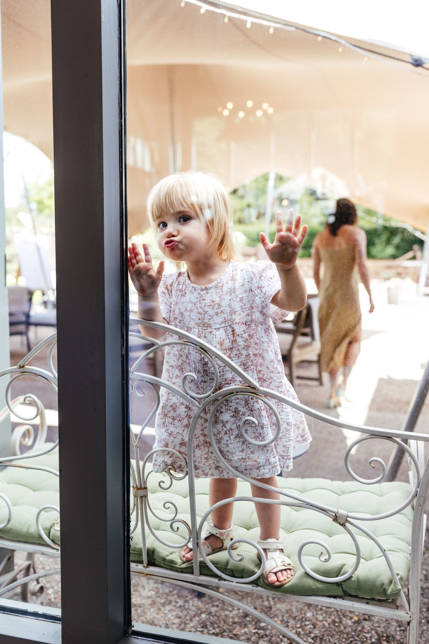 Candid wedding guest moment at Kimbridge Barn Romsey, relaxed barn wedding photography
