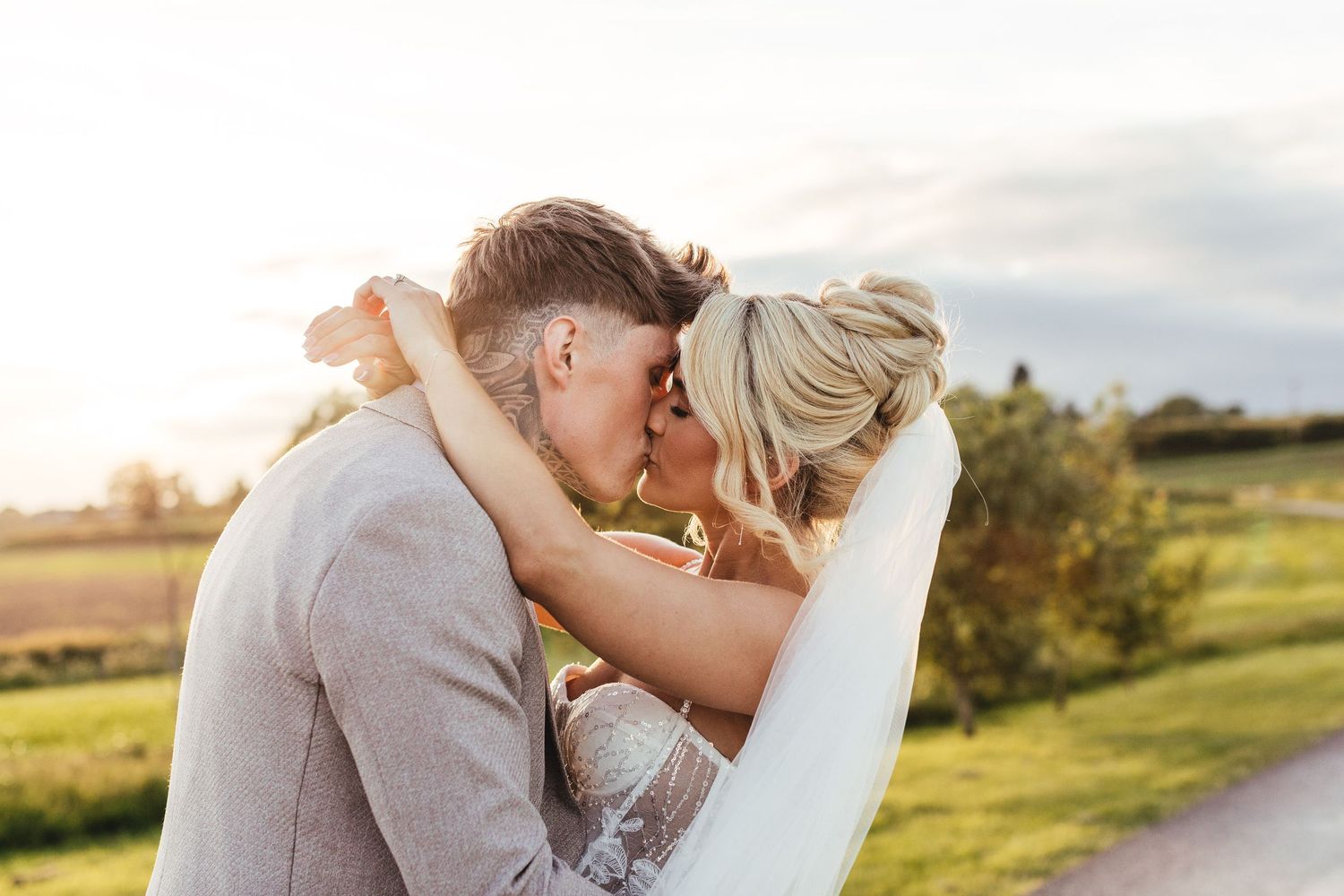 Grangefields Derbyshire sunset wedding photography, romantic golden hour couple portrait at luxury East Midlands barn venue
