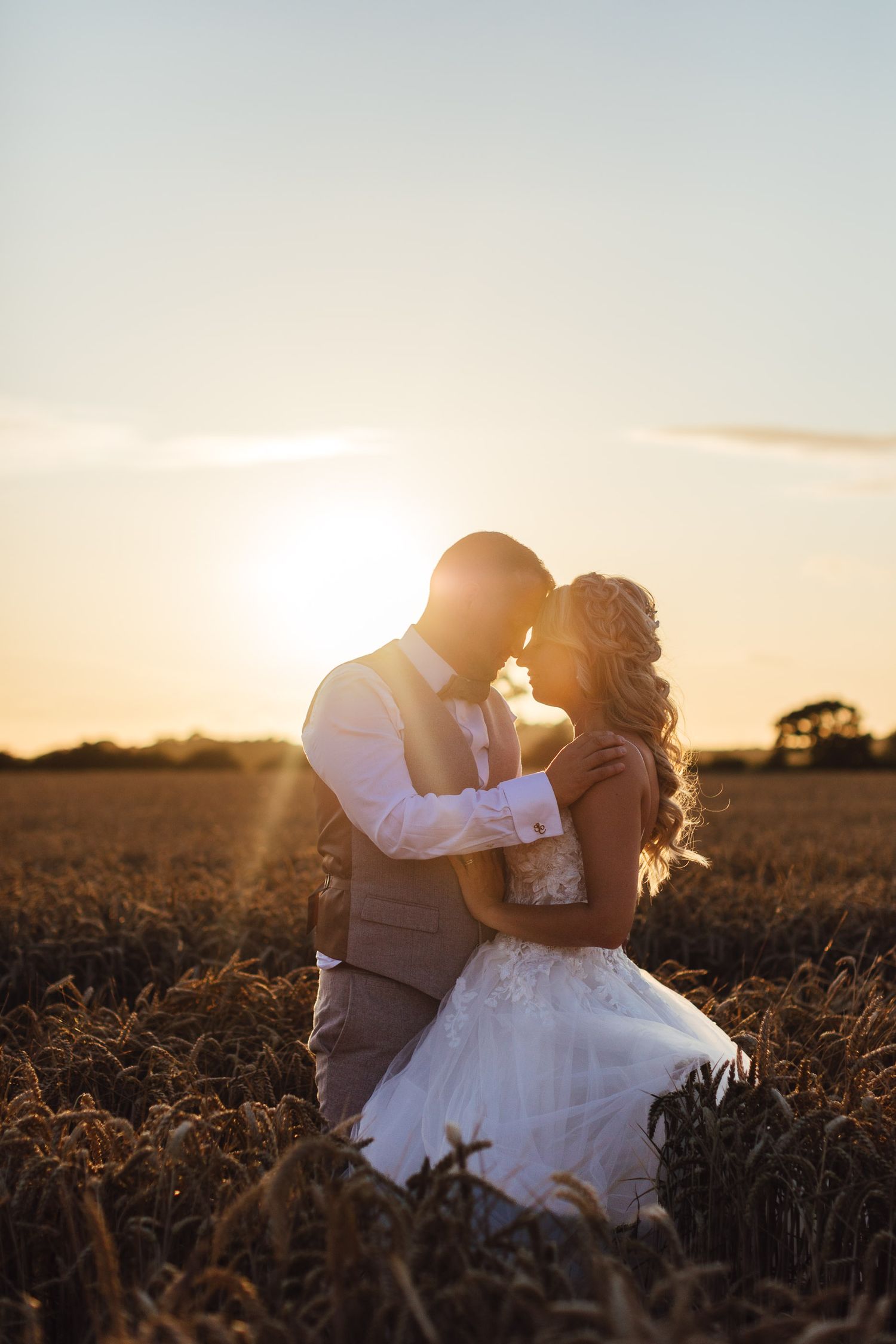 The Normans York sunset couple portrait in golden wheat field, romantic North Yorkshire summer wedding photography