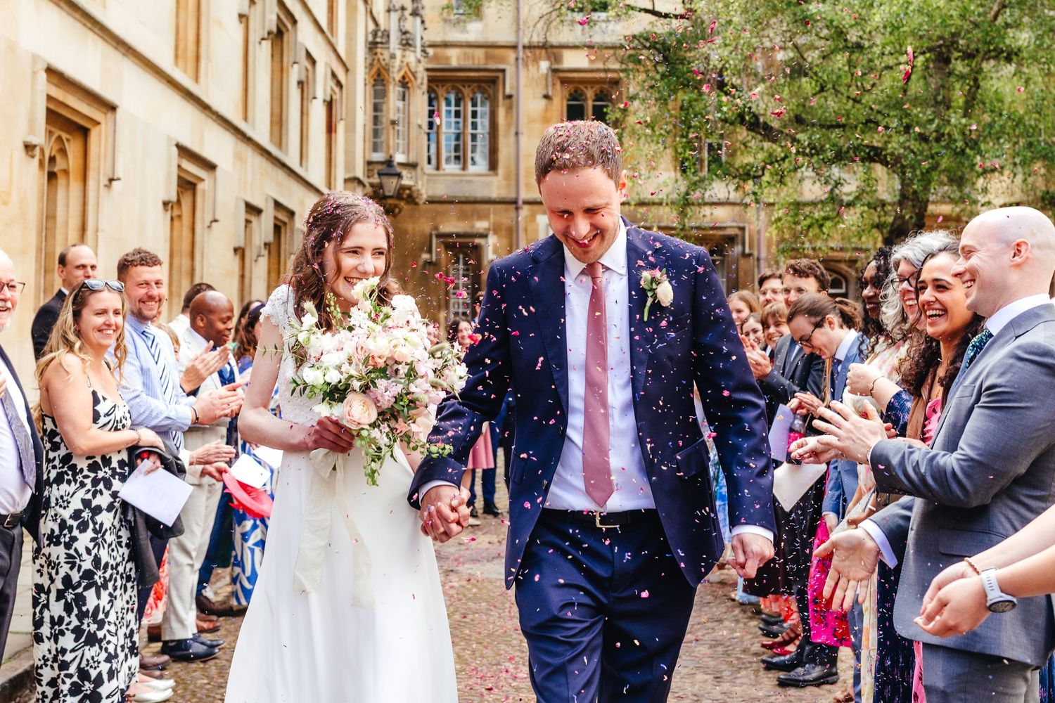 Confetti moment in Oxford city centre, summer wedding photography in Oxfordshire