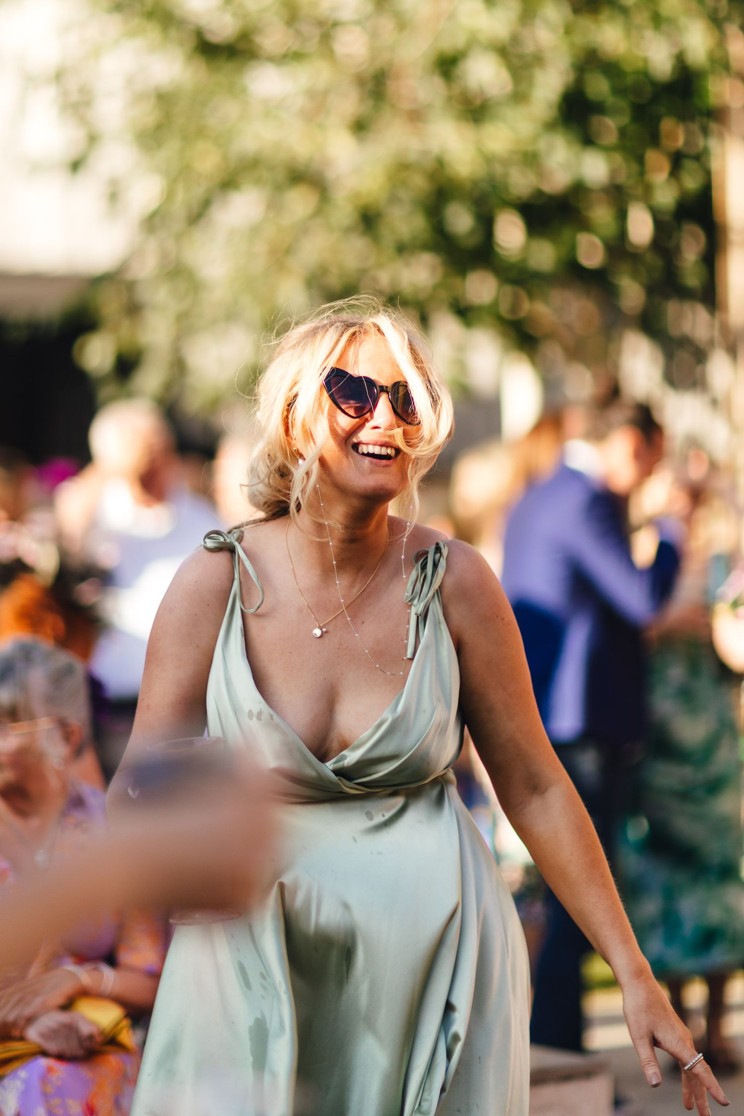 The Normans York wedding photography, stylish summer guest candid at North Yorkshire luxury barn venue