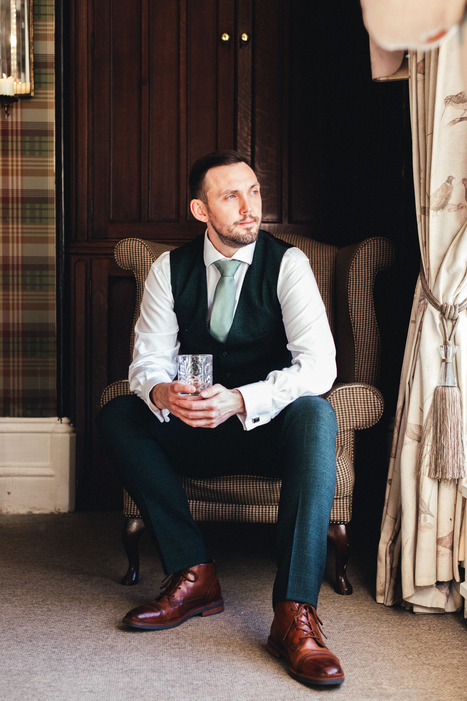 Groom getting ready at Falcon Manor Settle, natural light morning prep at North Yorkshire country house wedding venue